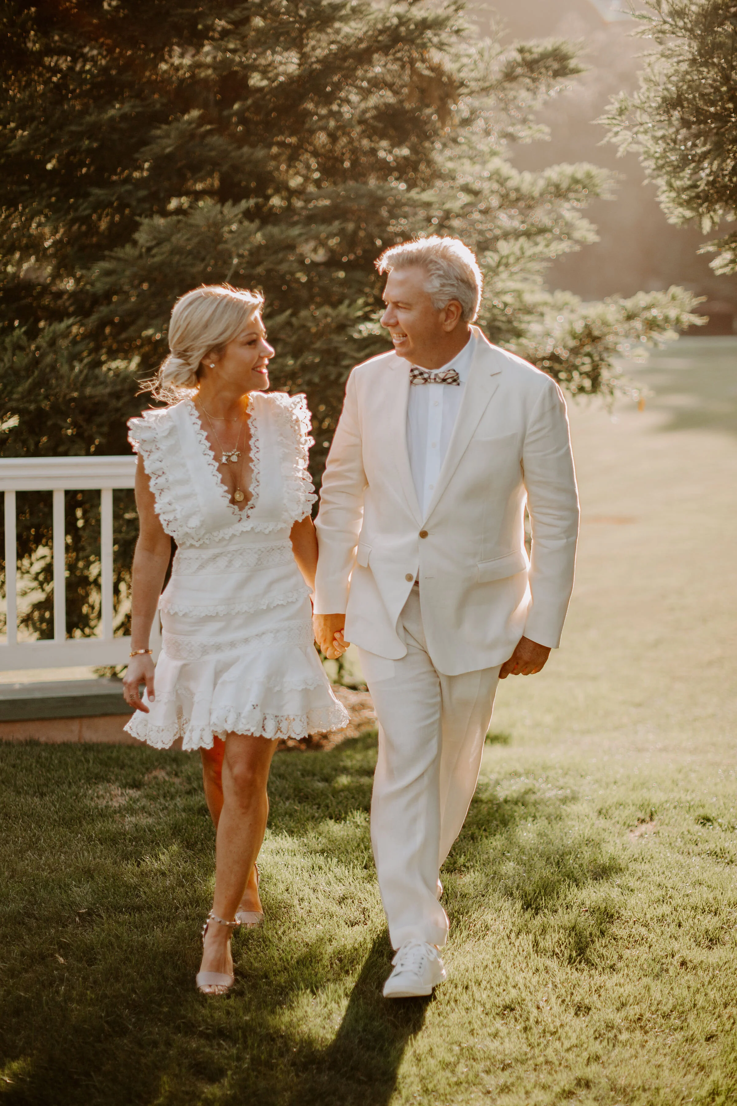 Couple walk hand in hand at Promontory Estates wedding in Oakville, CA image name: wedding-florist-boise-569