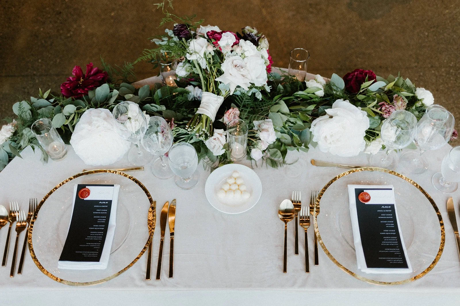Table setting white roses butter balls white peonies burgundy roses black and white menus image name: wedding-florist-boise-220