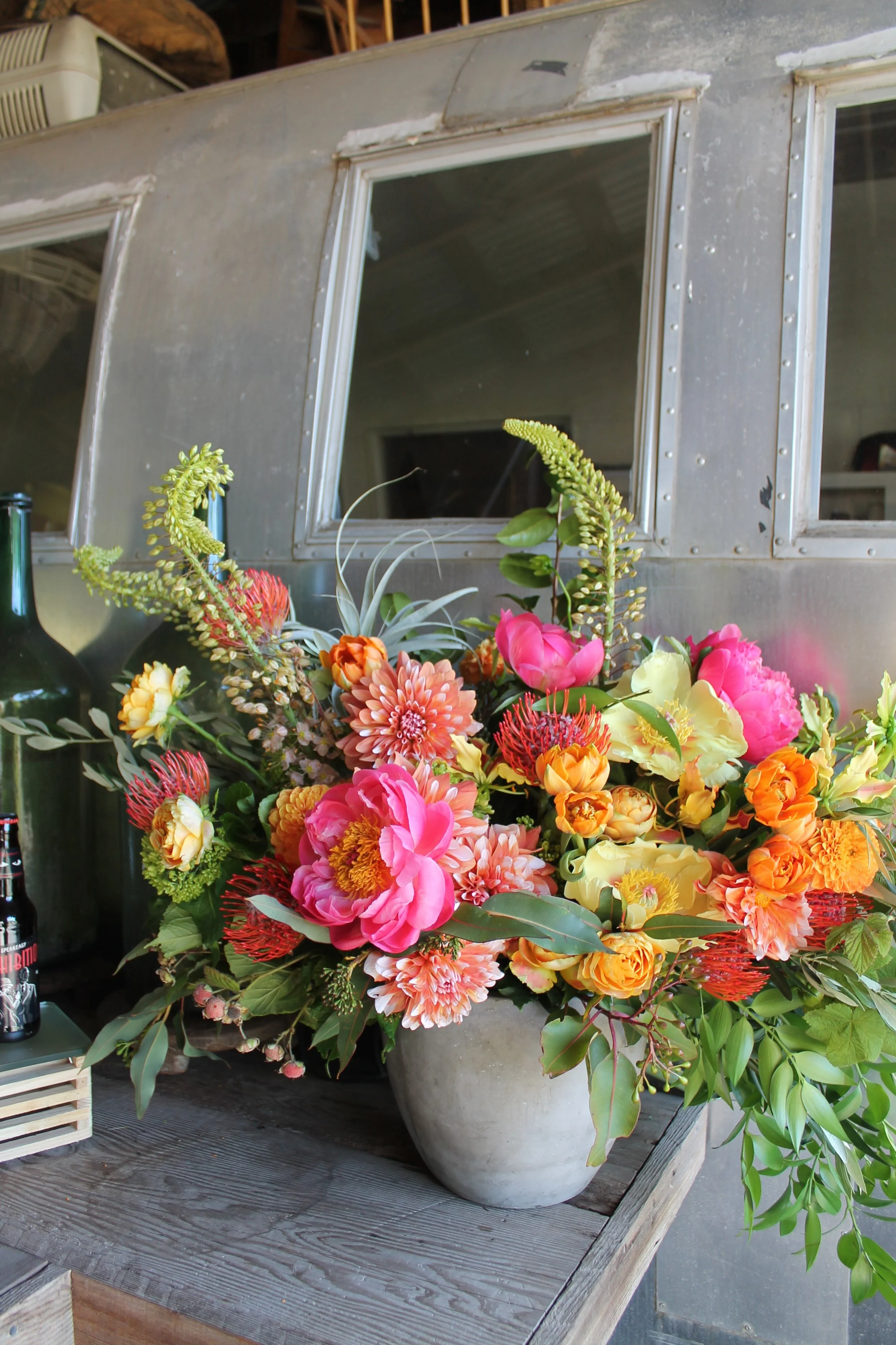 coral orange yellow flowers in front of airstream ranch sun valley