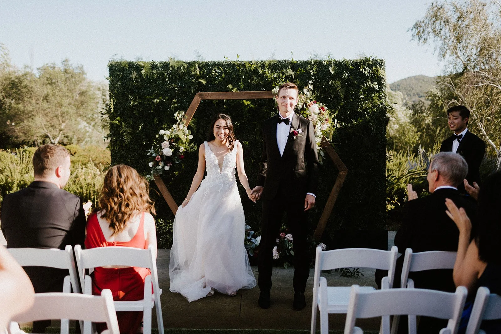 Couple standing Modern wooden hexagon alter wooden alter image name: wedding-florist-boise-204