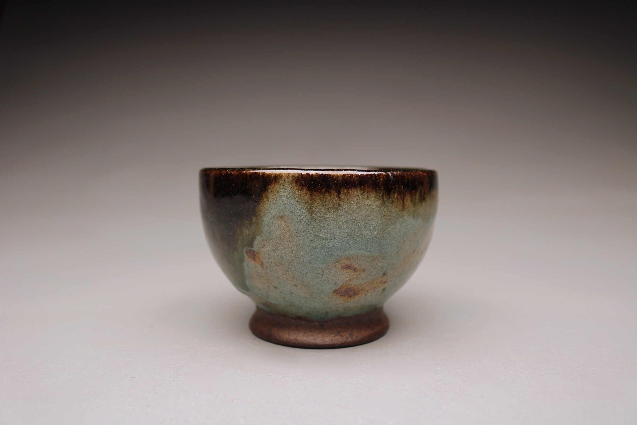 "Iron Bowl";
Black Stoneware, Temmokku, Celadon;
3" x 4.5" x 4.5";
2018