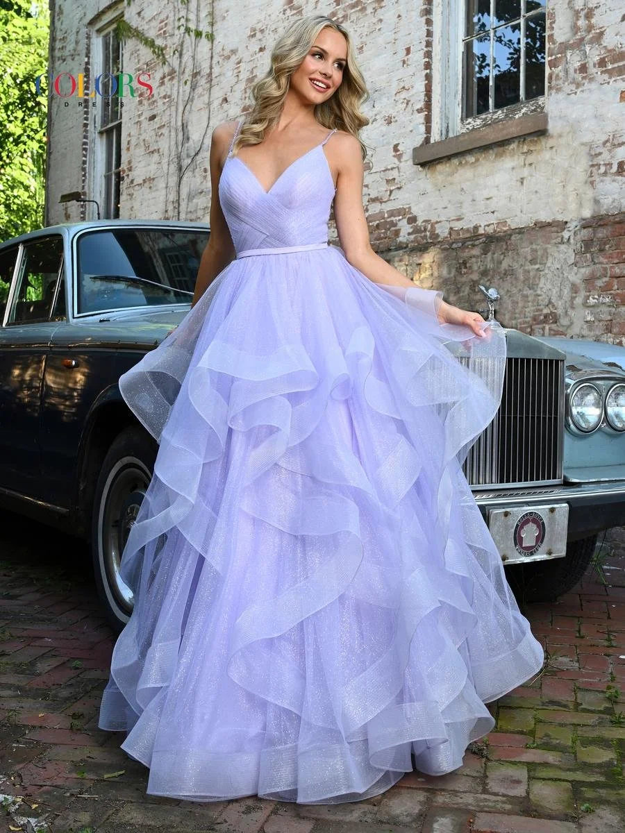Blonde woman in lavender tulle gown stands in front of a black classic car.
