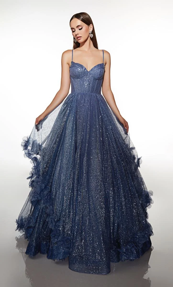 A woman in a dusty blue ballgown. The ballgown has layers of glitter tulle.