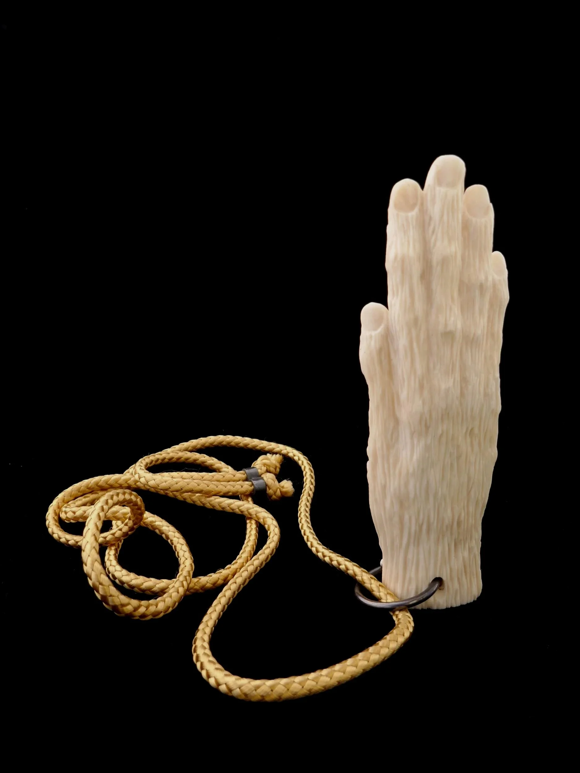 Hand of Dodd. Bone, sterling silver, cord. 2024