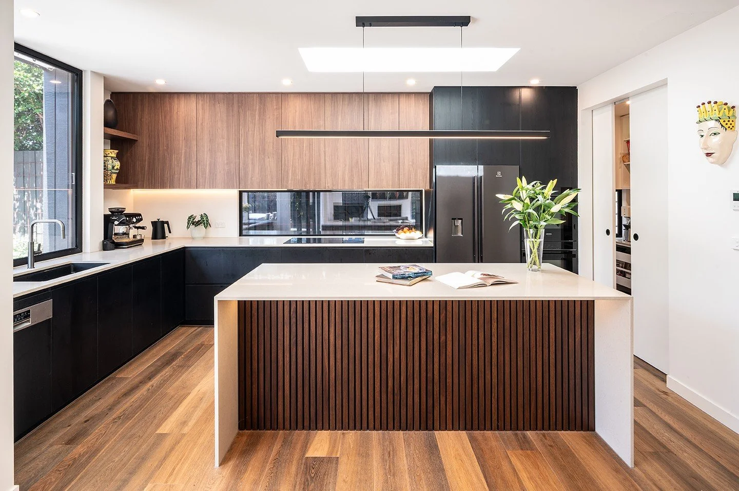 From boxed-in to beautifully free.

This kitchen transformation brings warmth, light, and flow back to the heart of the home.  Rich timber tones, sleek stone, and thoughtful detailing combine to create a sophisticated yet effortless space that feels 