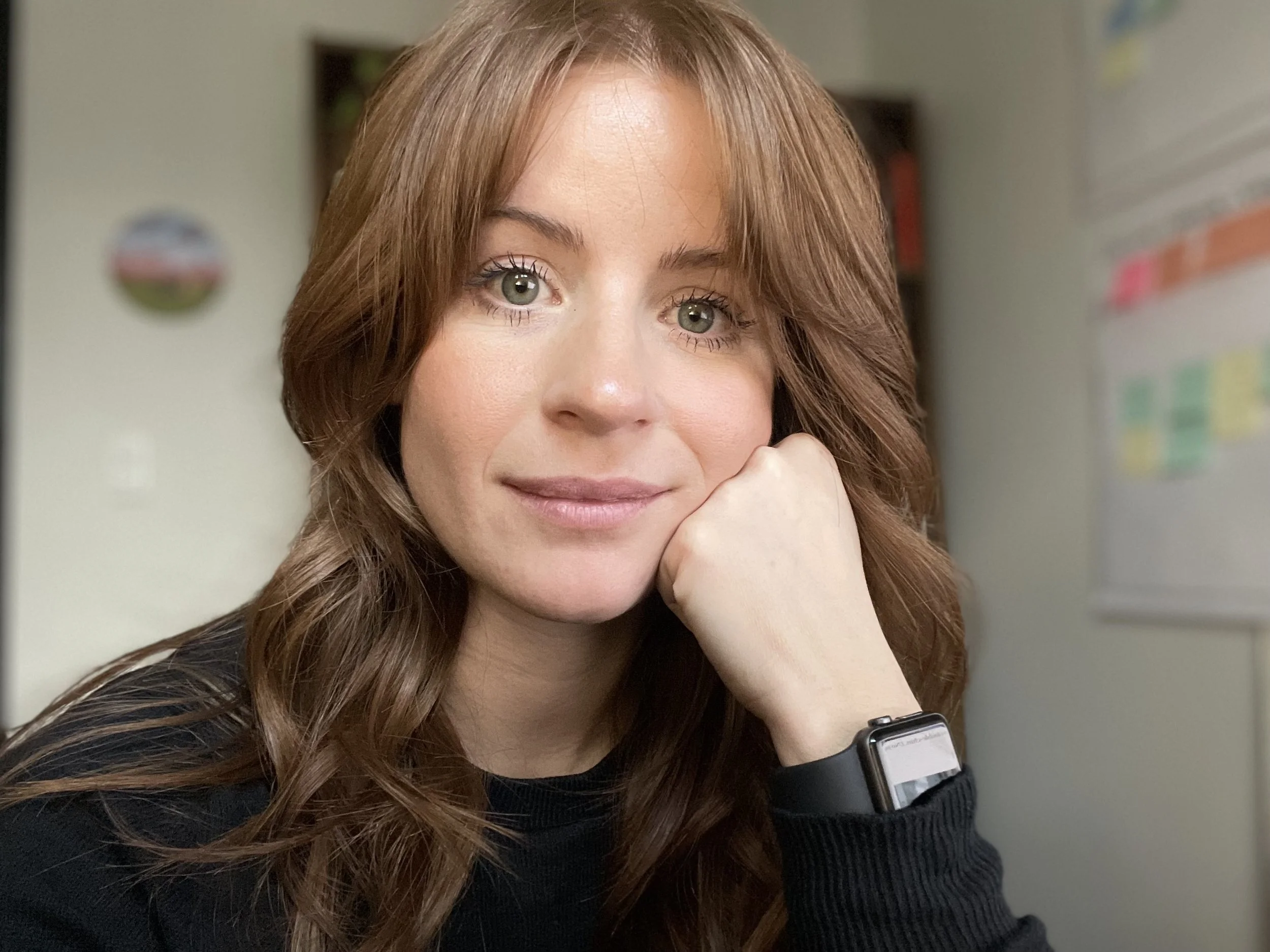 Natasha Steinback, systems thinker and community impact strategist at Tilia Consulting, standing in a natural outdoor setting