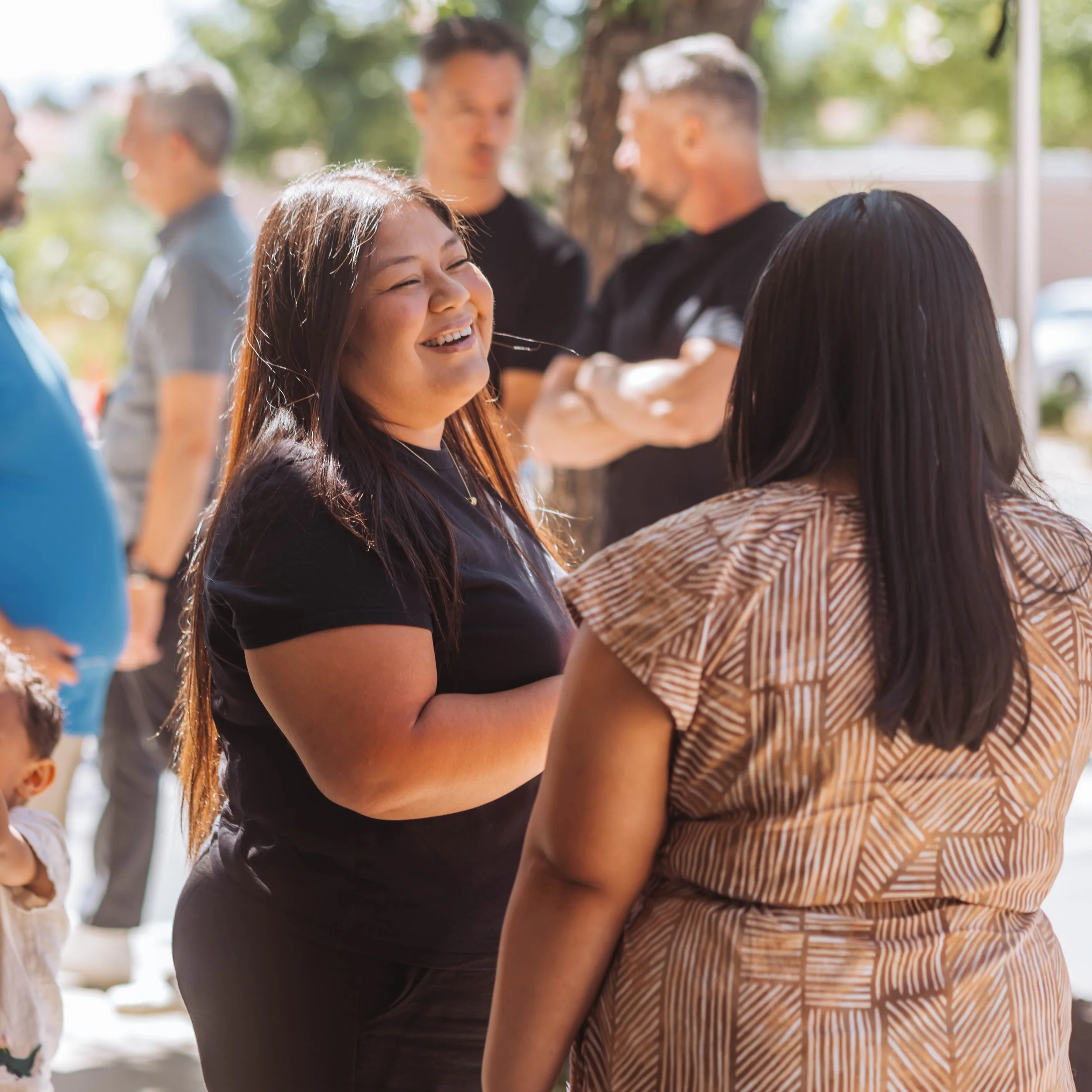 An image of church members smiling and talking.