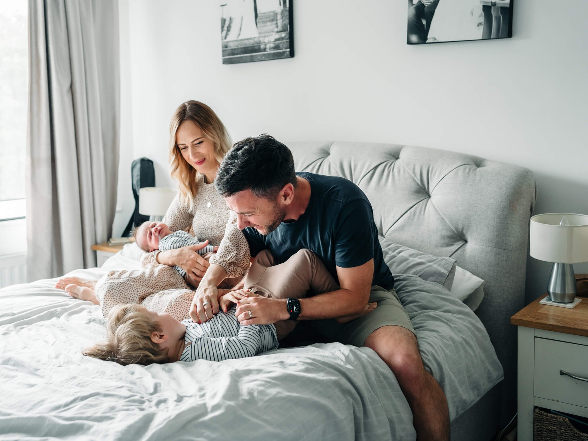  Family on bed and dad tickling little boy by The Corbett Creative Photography Rugby 