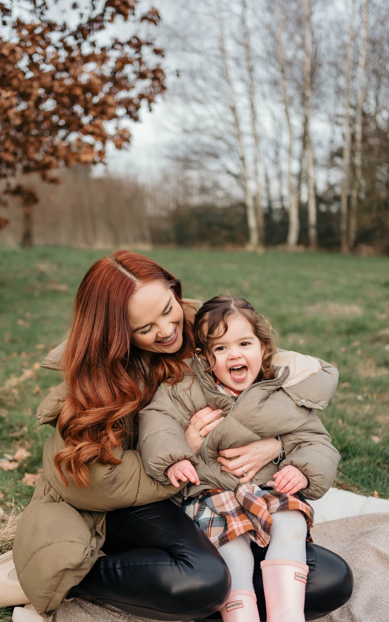  Mum with red hair tickling daughter by The Corbett Creative Photography in Rugby 