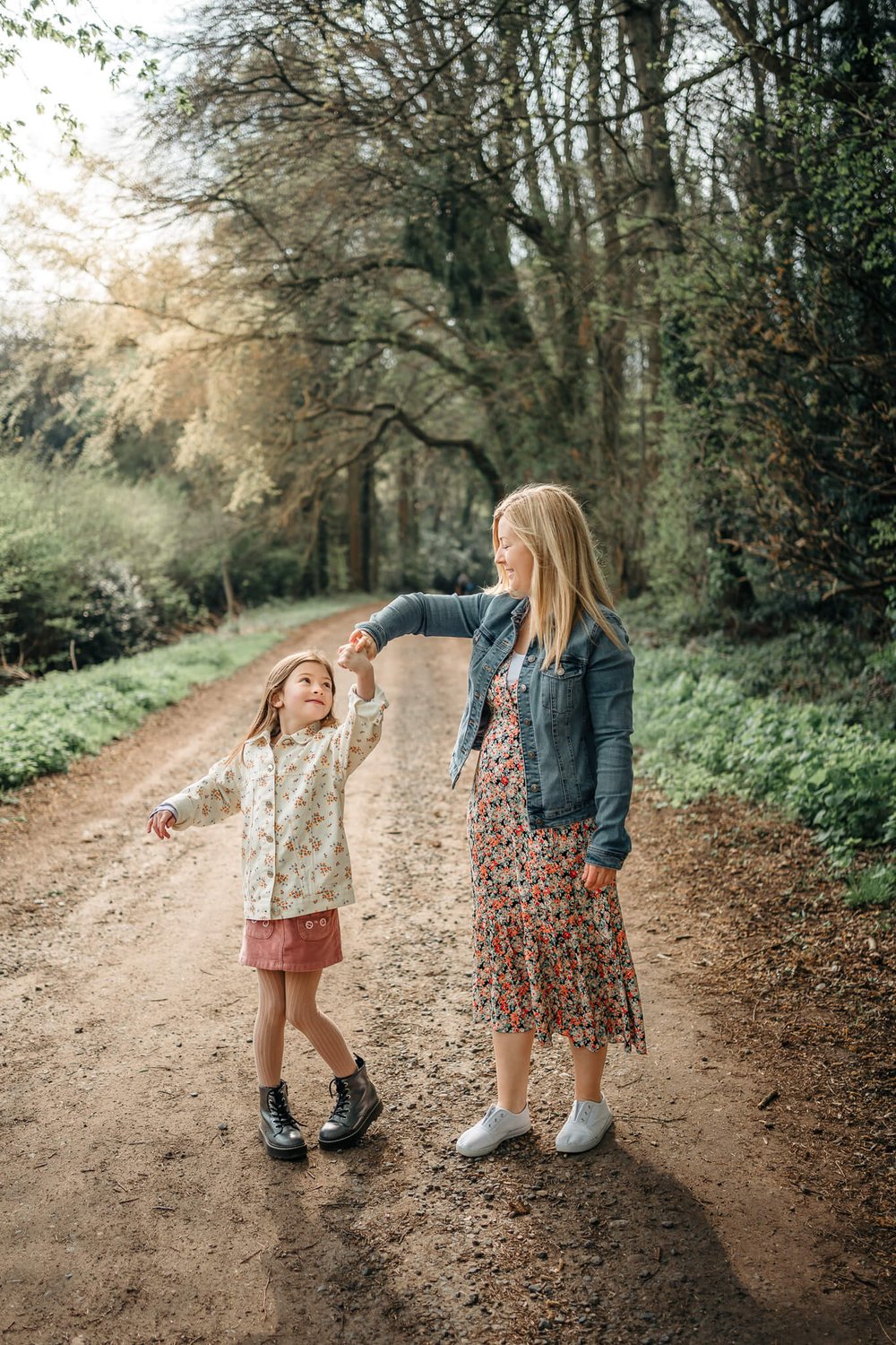 Mum twirling daughter in Cawston Woods Rugby