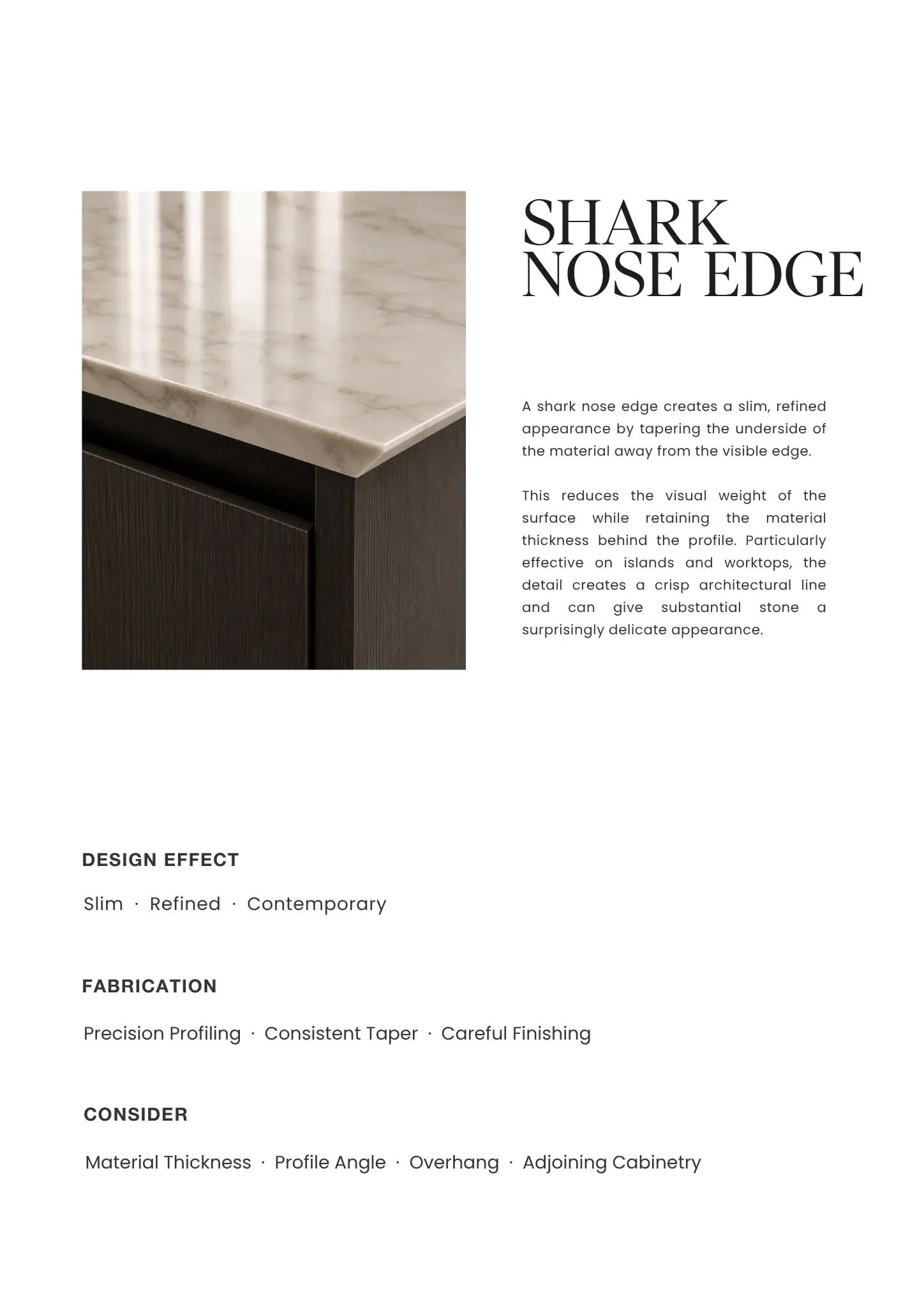 Close-up of a marble countertop with a dark wood cabinet below.