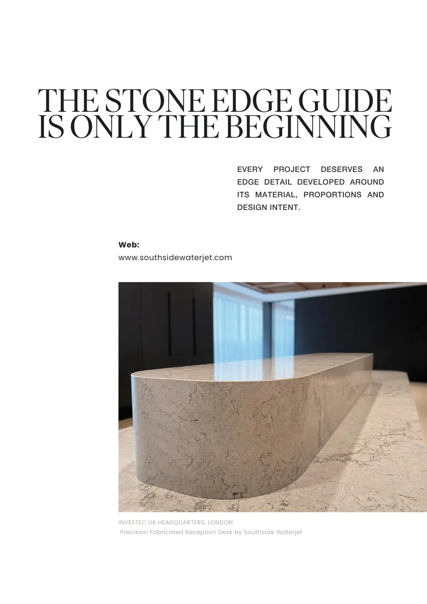 A curved, polished stone reception desk made of light-colored marble with subtle veining, located in the lobby of a modern office building.