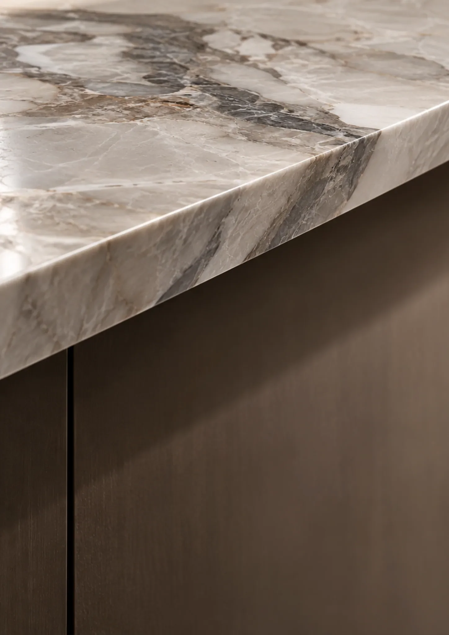 Close-up of a polished natural stone worktop showing the finished edge and veining.