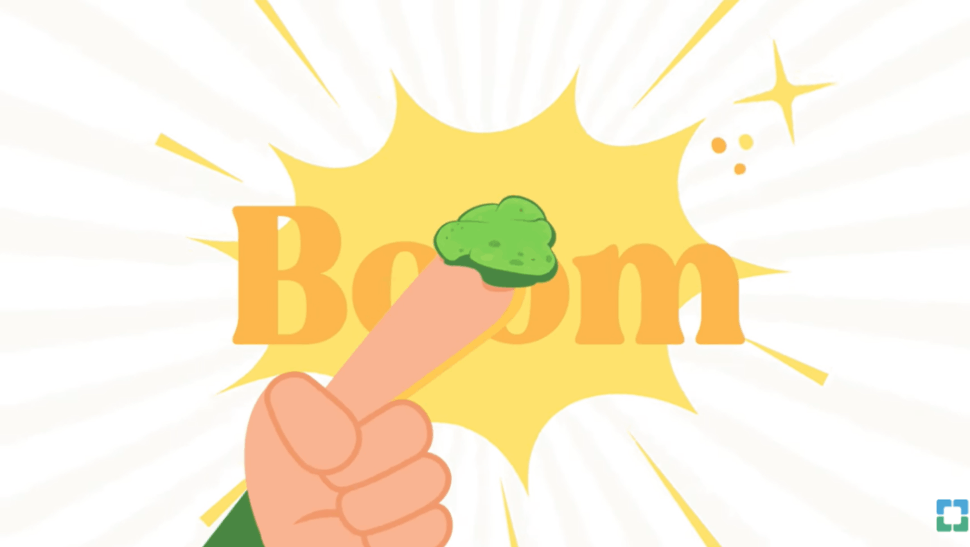 Finger pointing at green booger beside boom text