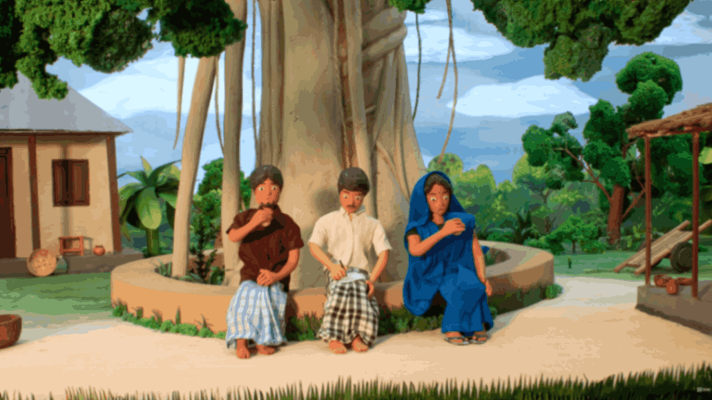 Three children sitting beneath a large tree eating together in a village courtyard.