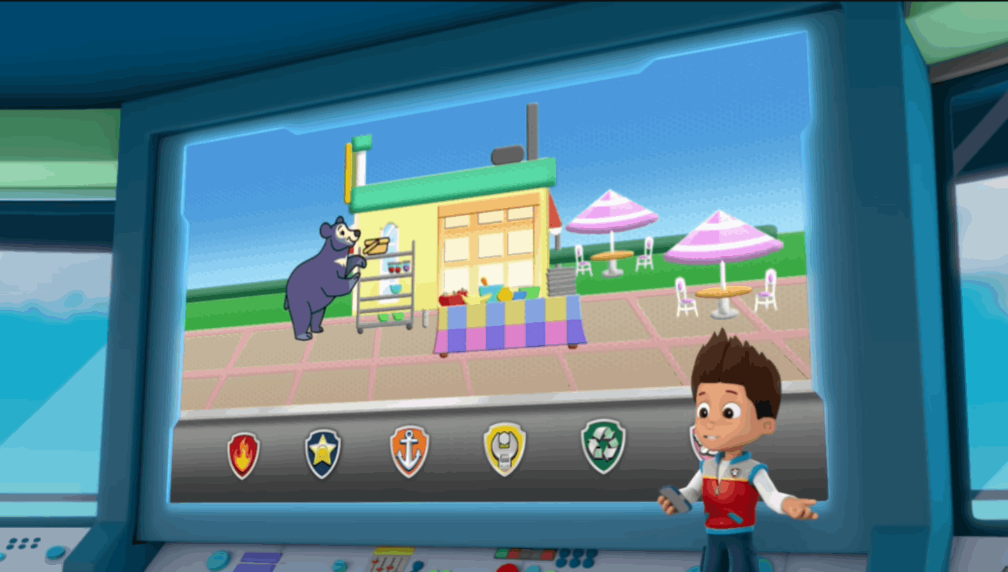 Boy presenting emergency situation on large screen with Paw Patrol team badges displayed below