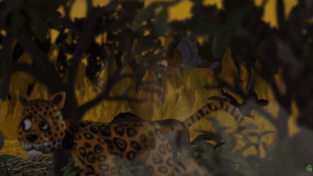 Jaguar crouches low as fire burns through the surrounding forest.