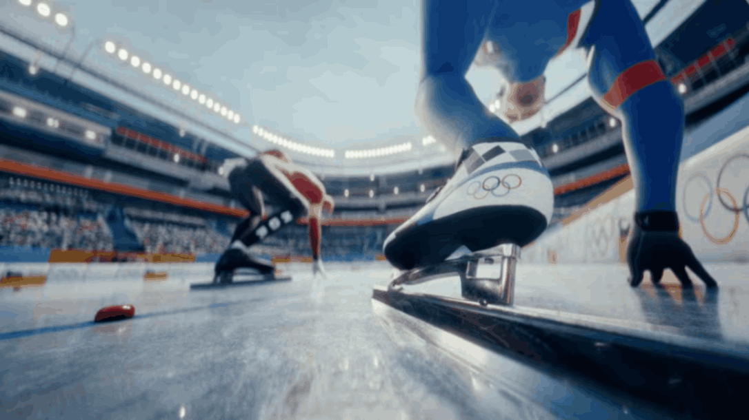Speed skater pushing off starting block on indoor Olympic ice track