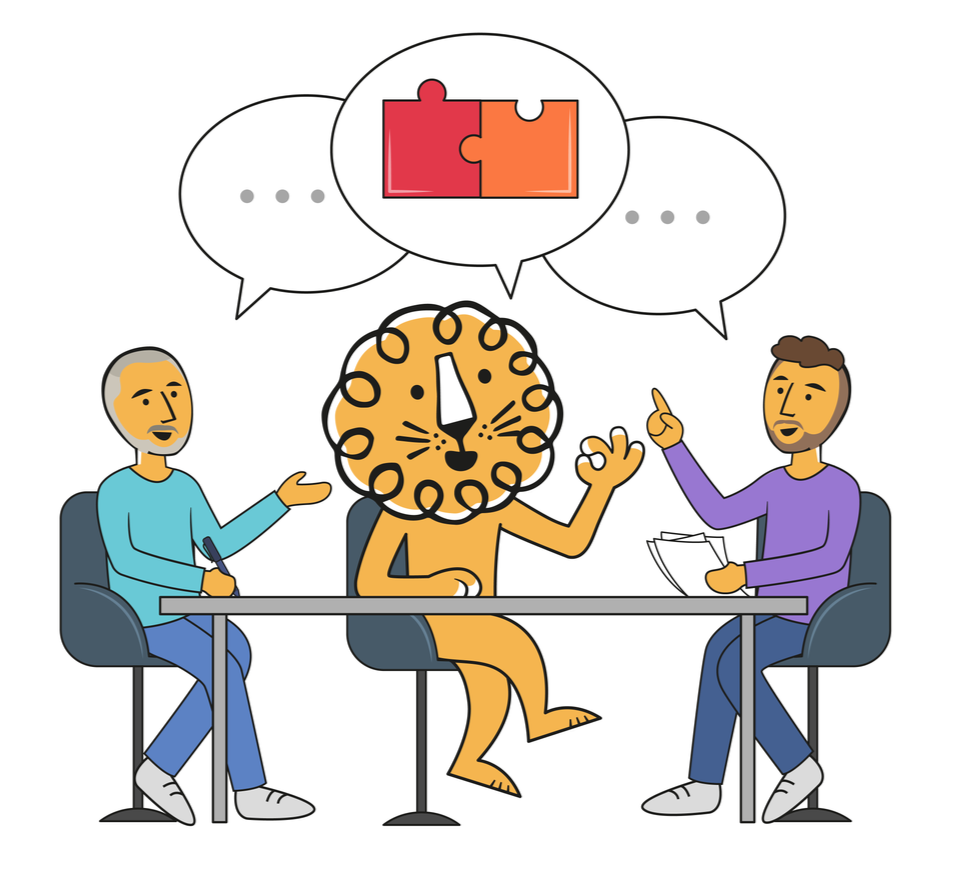 Leon the lion discussing ideas at a table with two colleagues, with speech bubbles showing collaboration and planning.