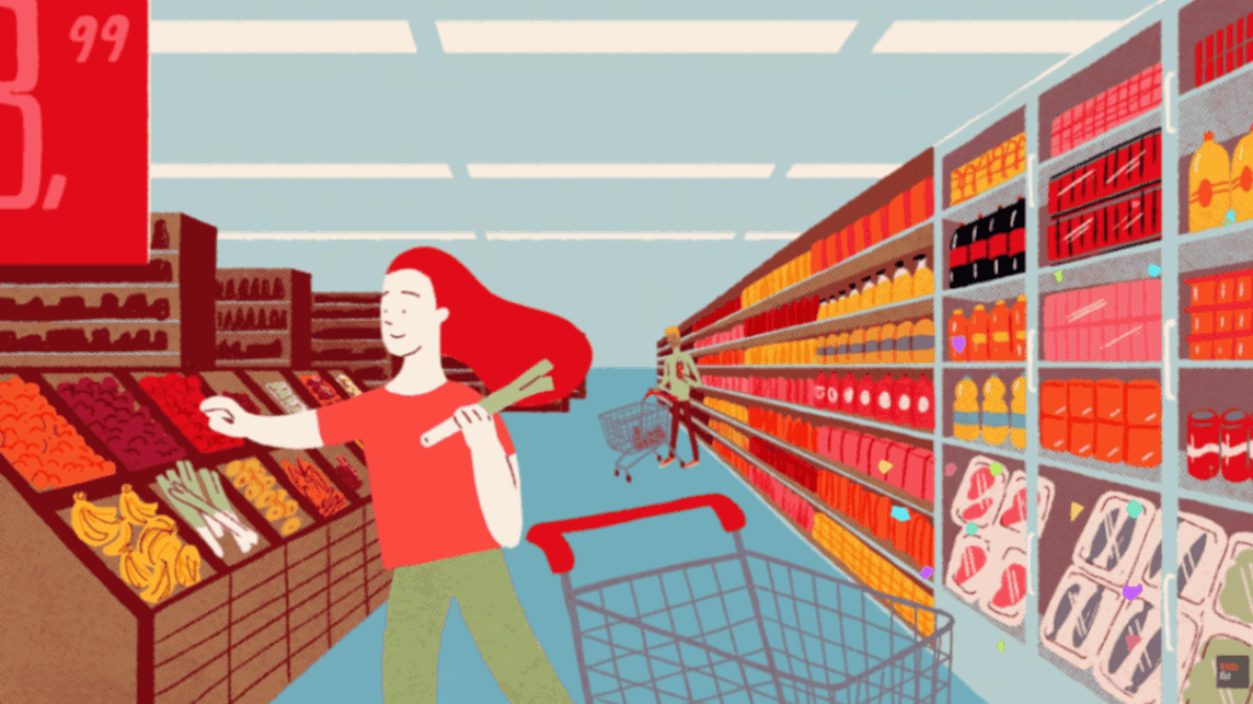 Woman shopping in a supermarket aisle filled with packaged foods and drinks while pushing a shopping cart.