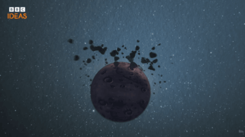 Dark asteroid breaks apart as debris scatters through deep space.