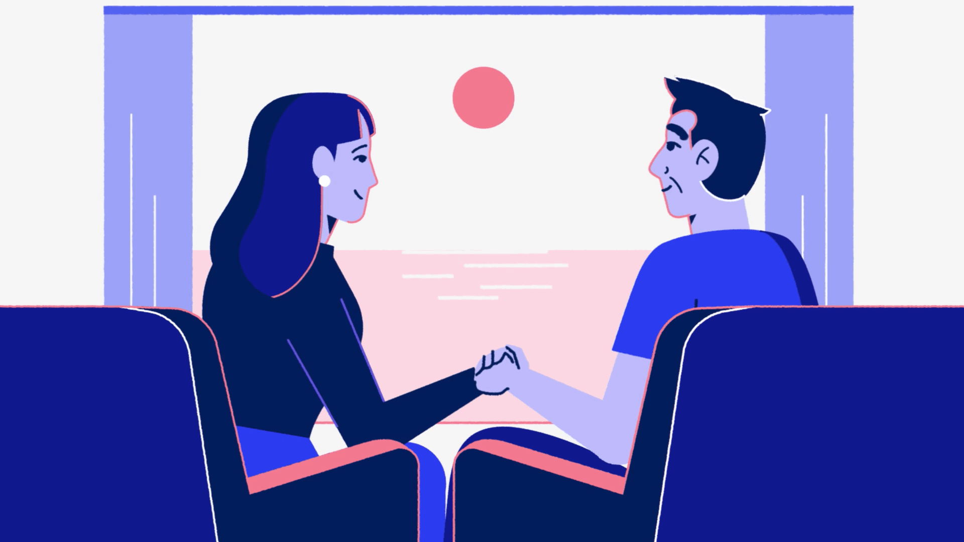 Couple sitting together holding hands while watching the sunset through a window