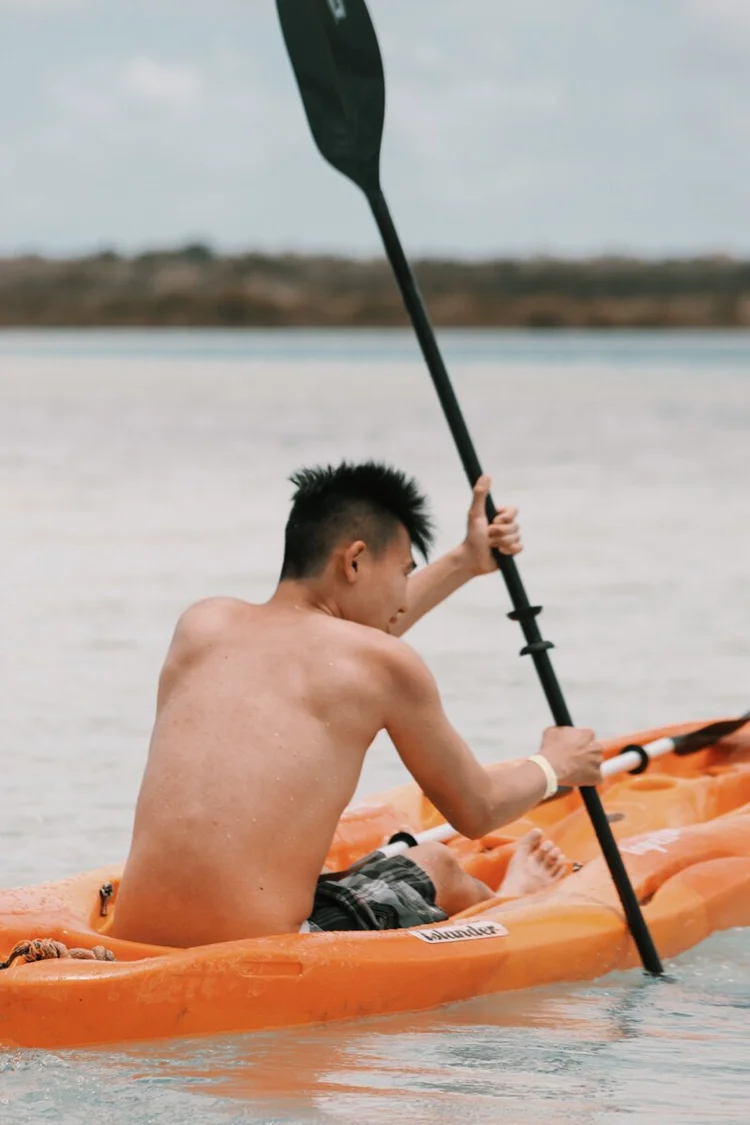 a kayaker at laguna kaan luum in tulum