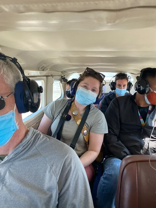 a girl sitting inside a plane on a nazca lines flight tour