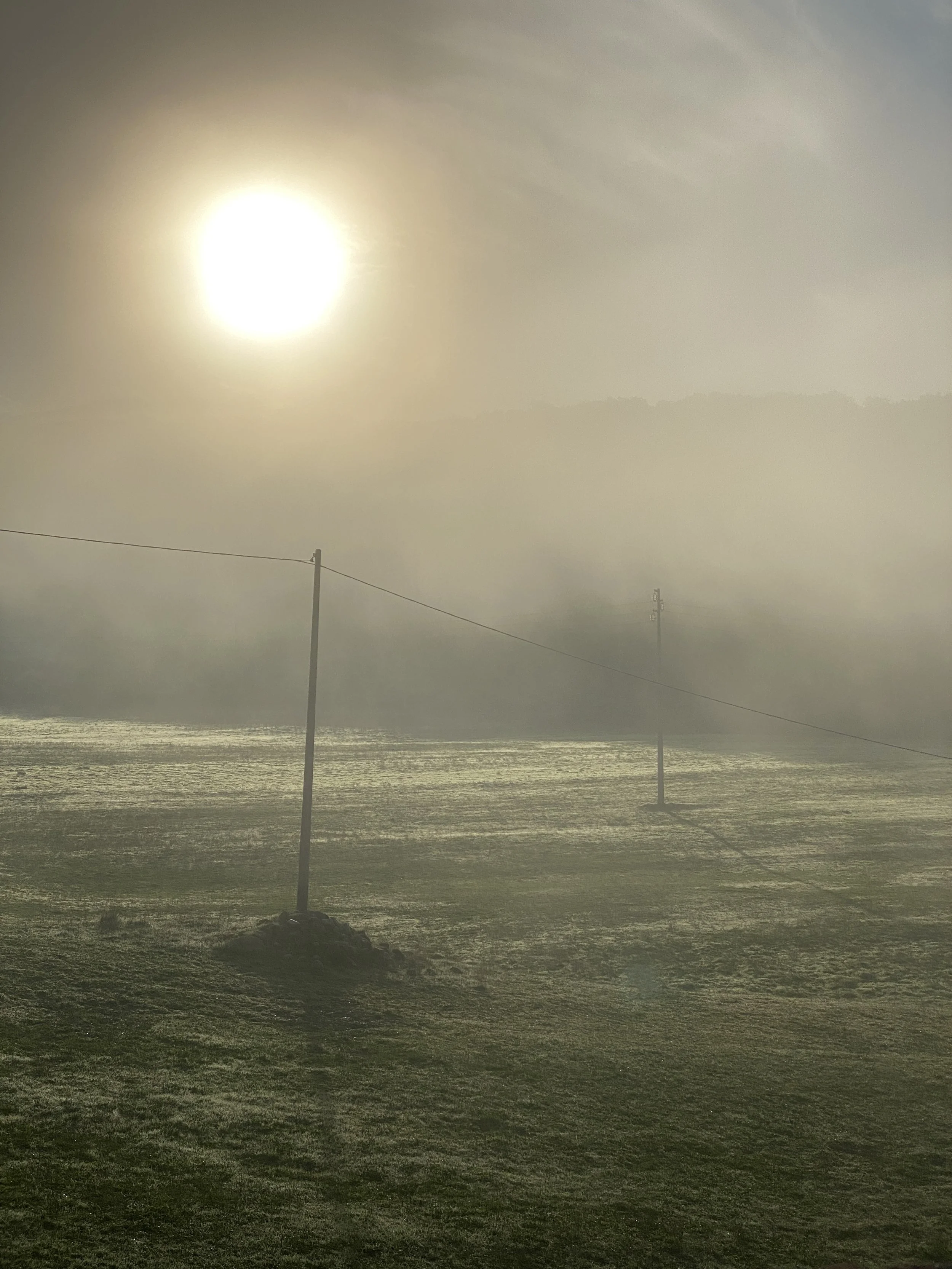 Sun fading in the misty valleys.