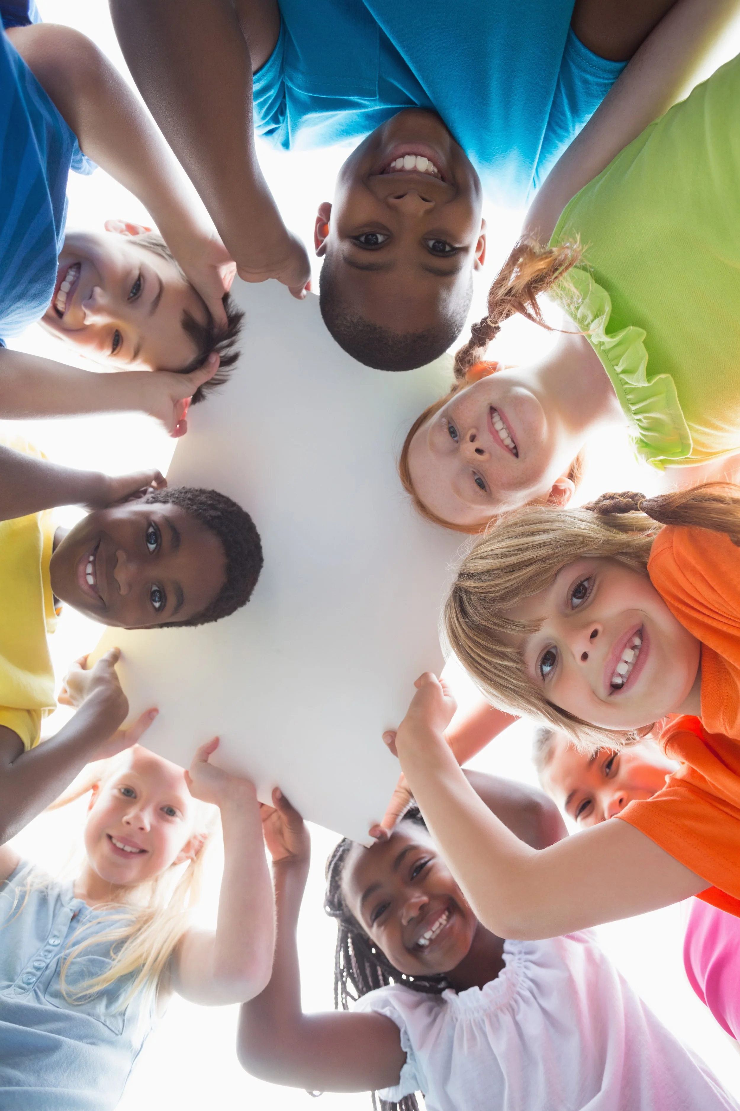 Students smiling at the camera outdoors