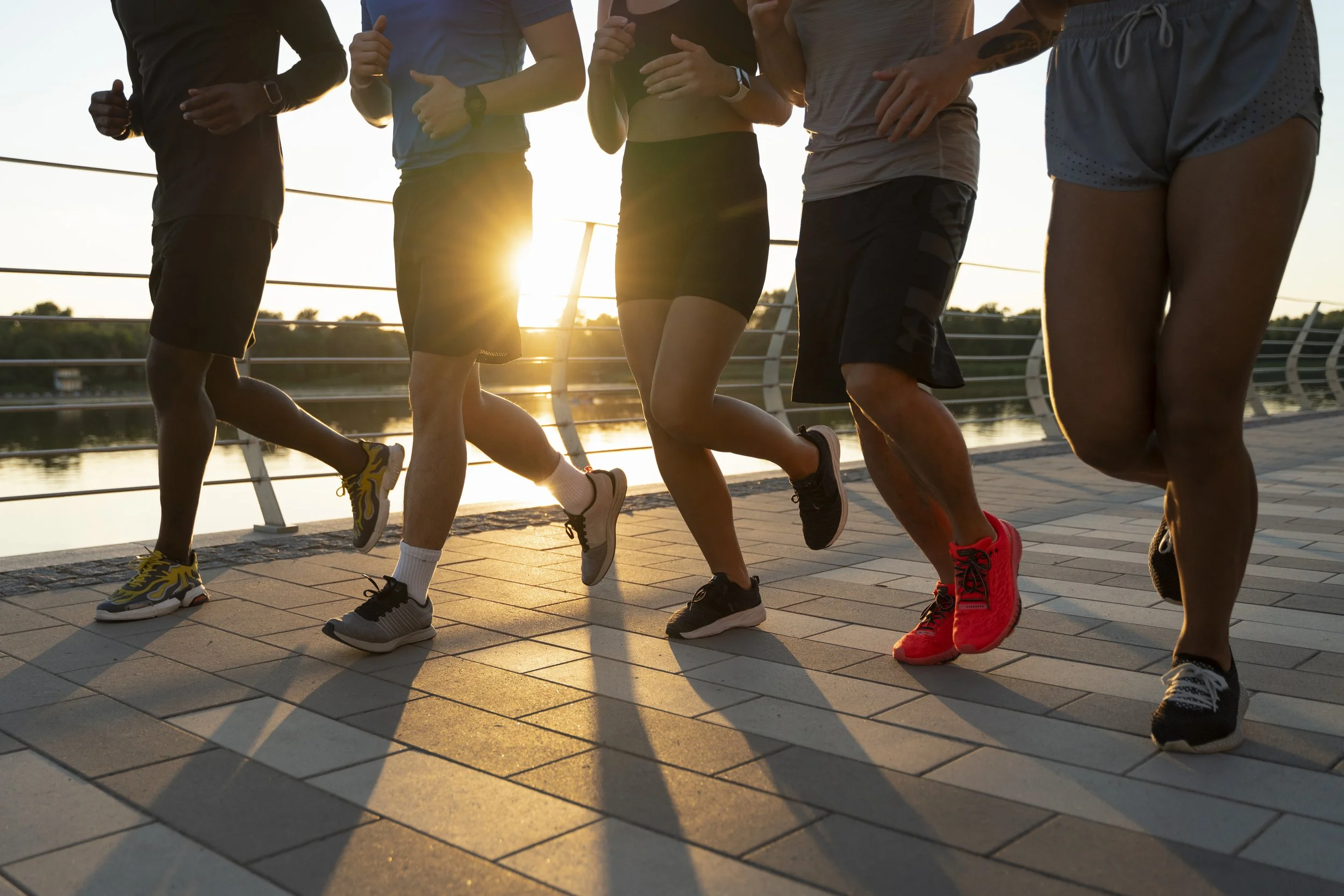 Group of friends running together outdoors