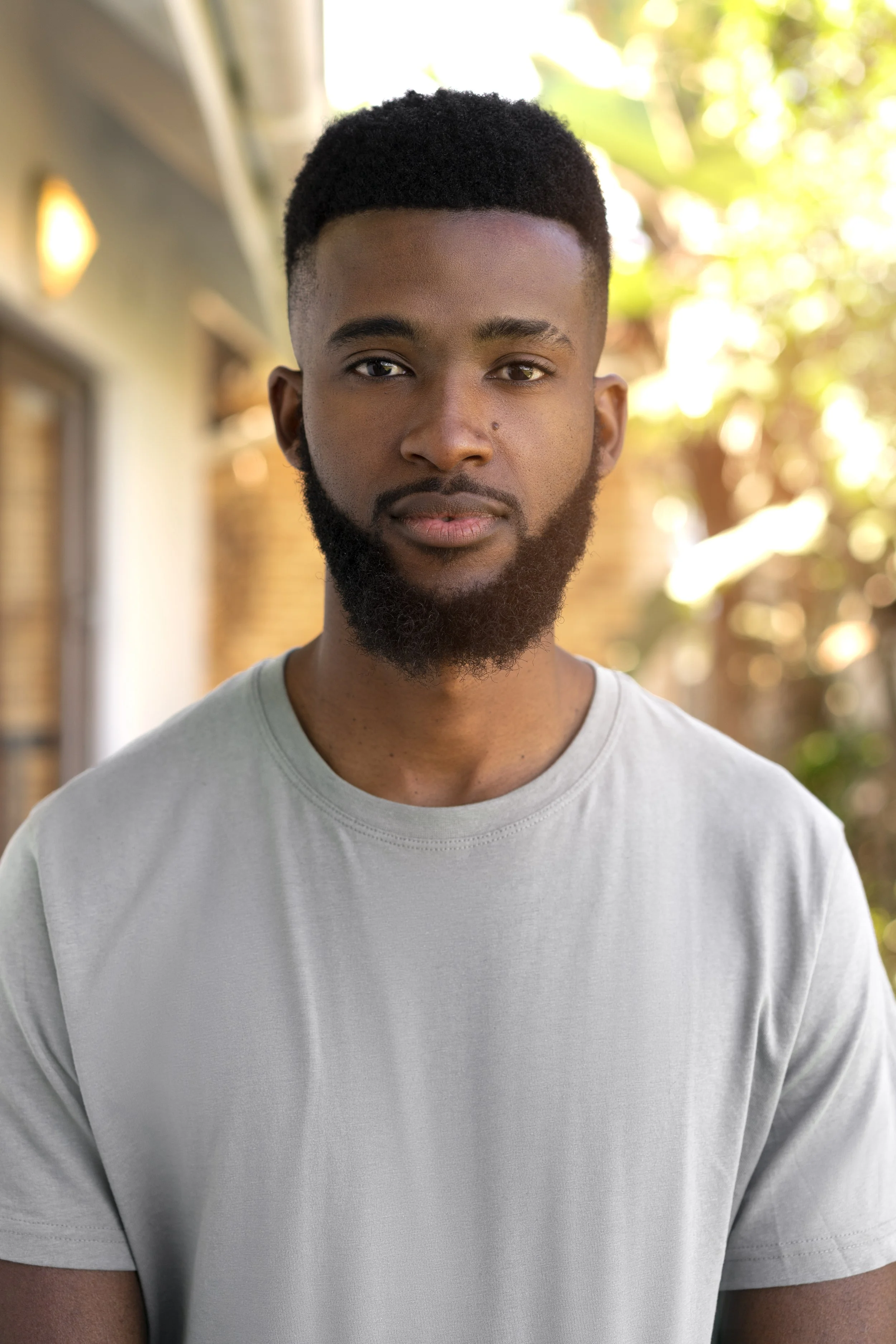 Man standing and posing for a photo