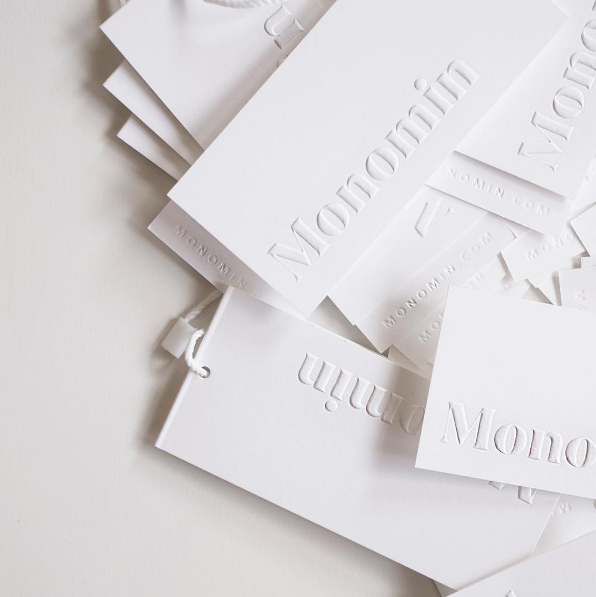 Blind emboss hang tags designed for retail brand, Monomin.