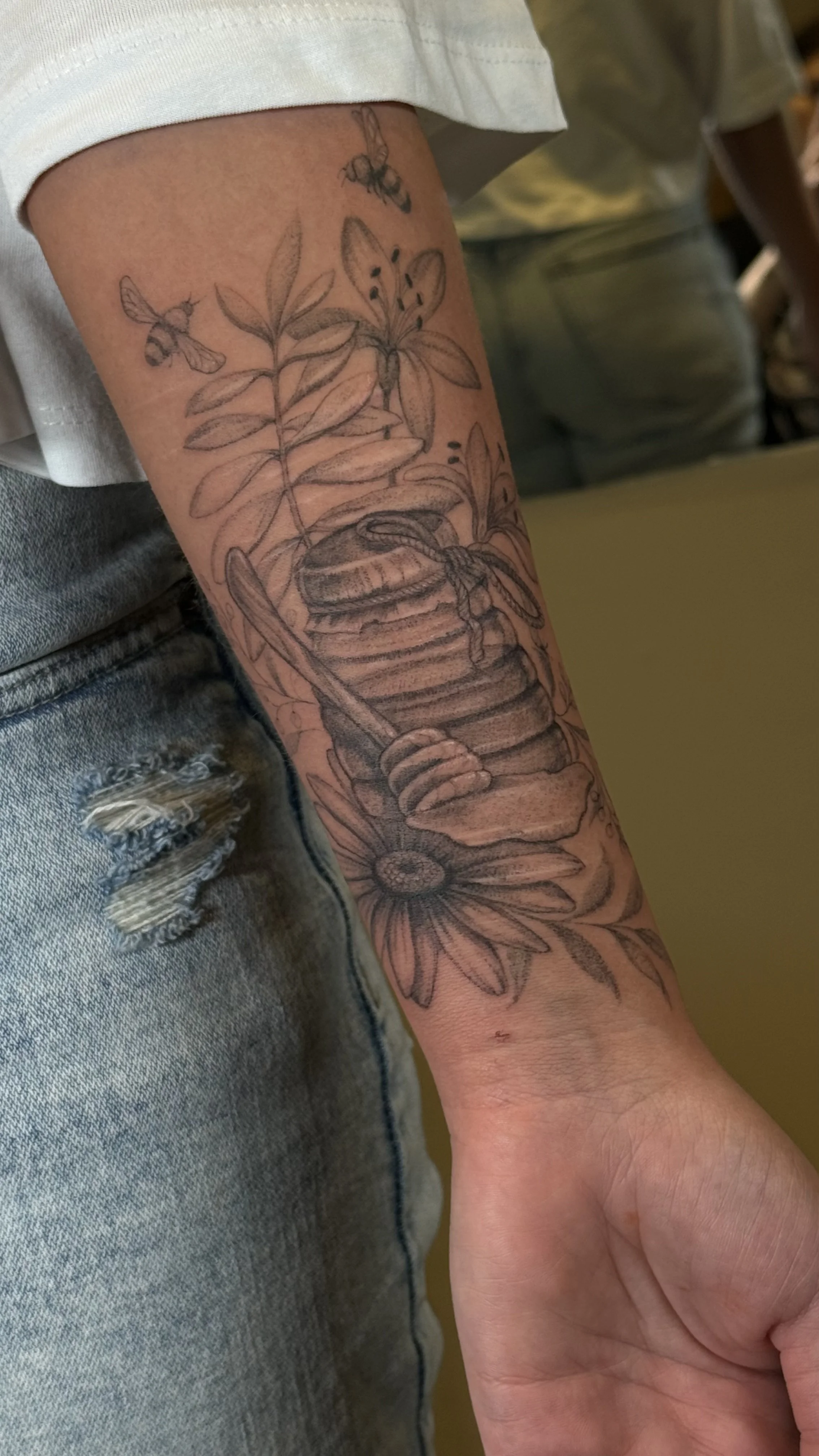 Finished botanical scar cover-up tattoo designed to blend the scars into the composition.