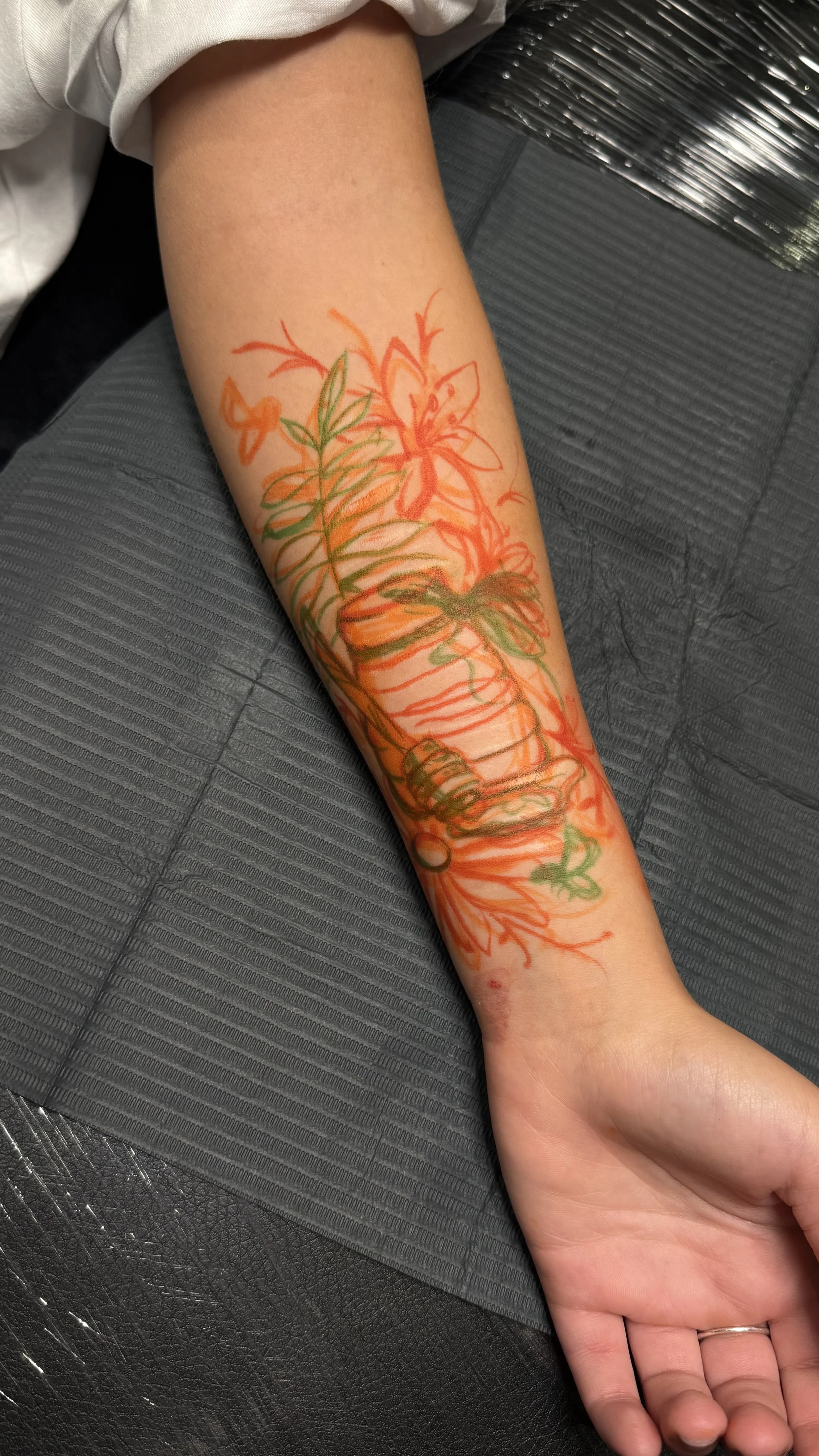 botanical design for scar cover-up tattoo designed to camouflage visible scarring on the forearm.