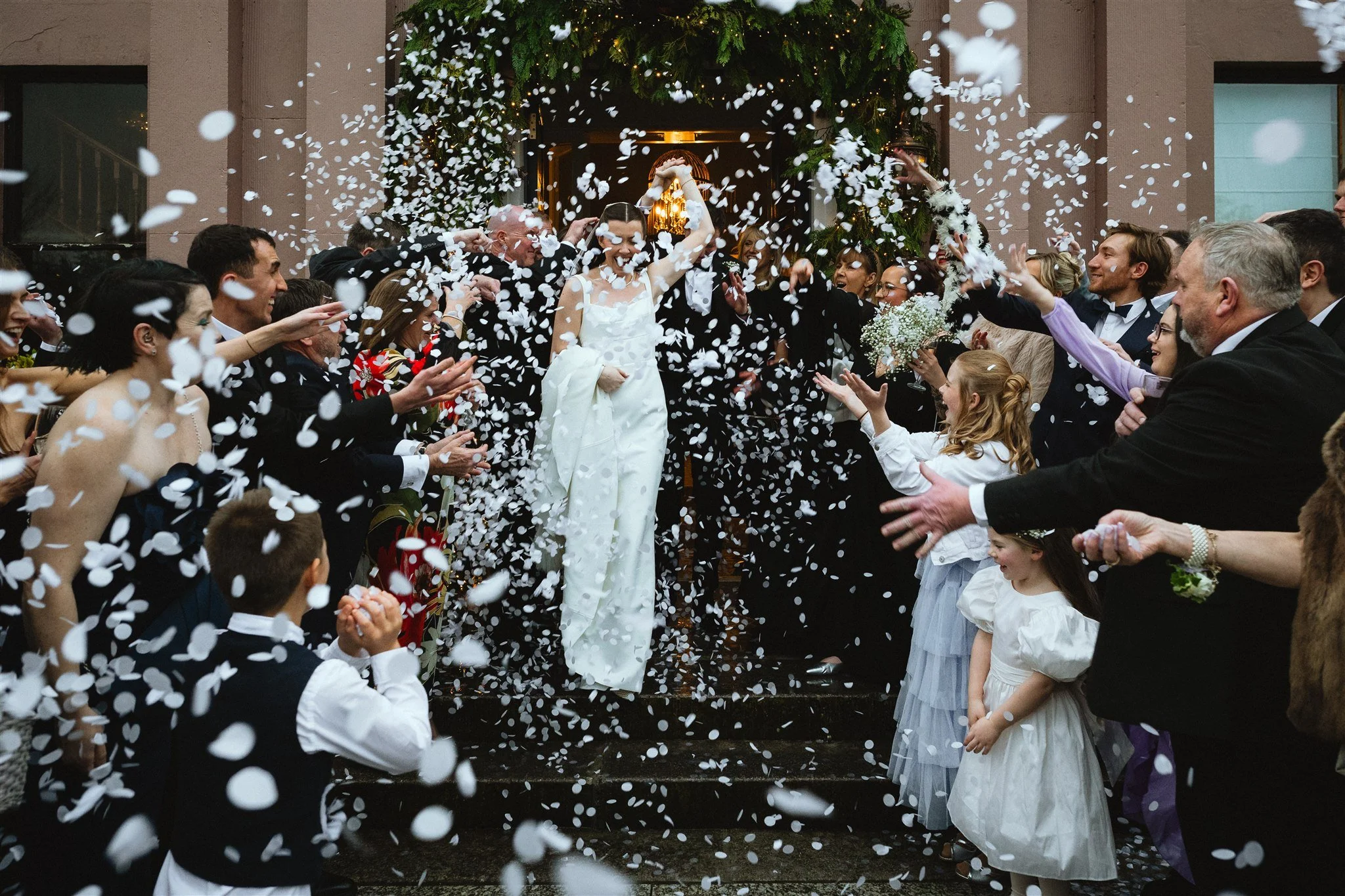 bride and groom cuddle on the driveway of Clonabreany House 