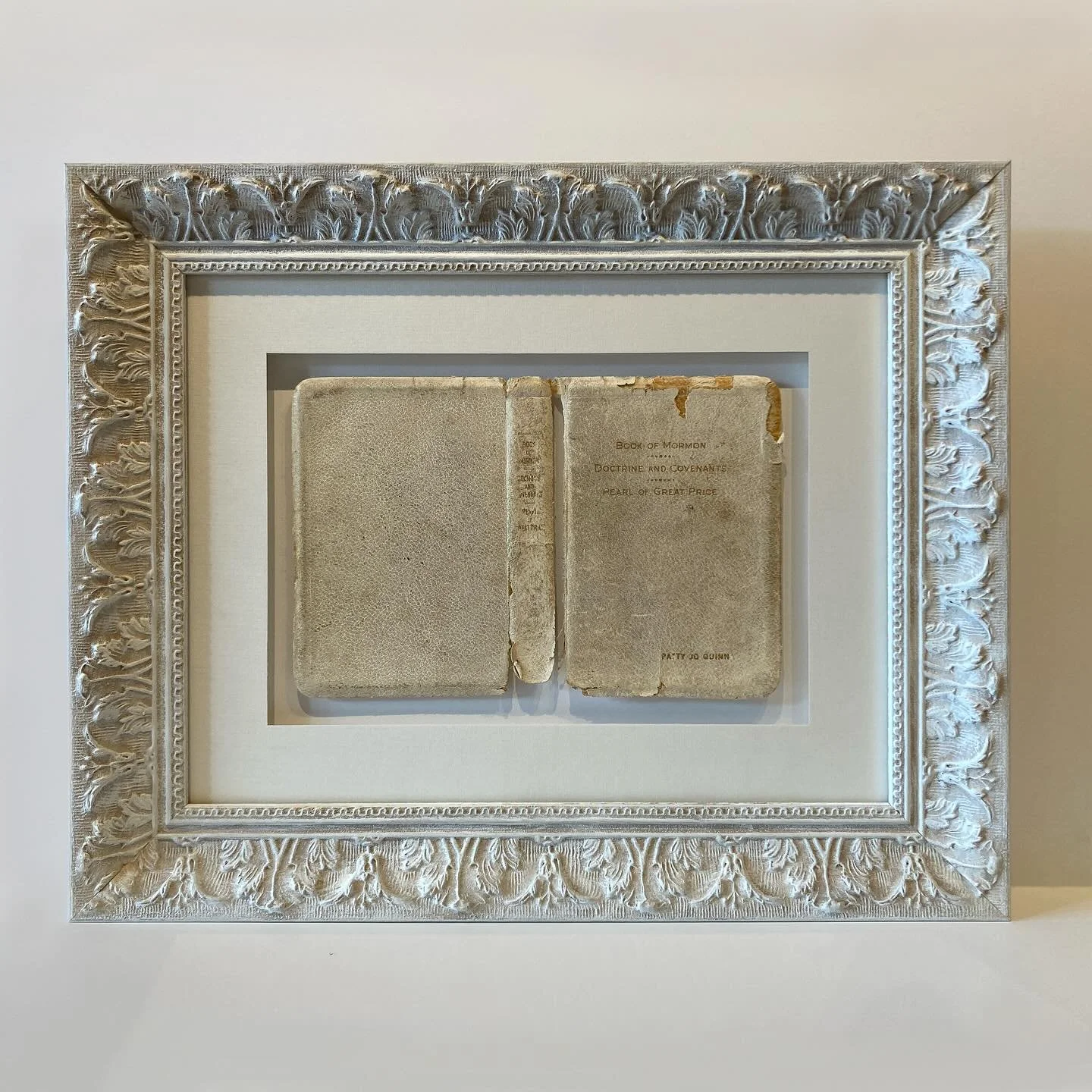 A successfully float mounted “Book of Mormon” cover in a quiet, monochromatic color scheme. Finished with a beautifully traditional ornate. Design and execution by @blacksabbathbyblacksabbath 
Come in Thursday, Friday or Saturday before