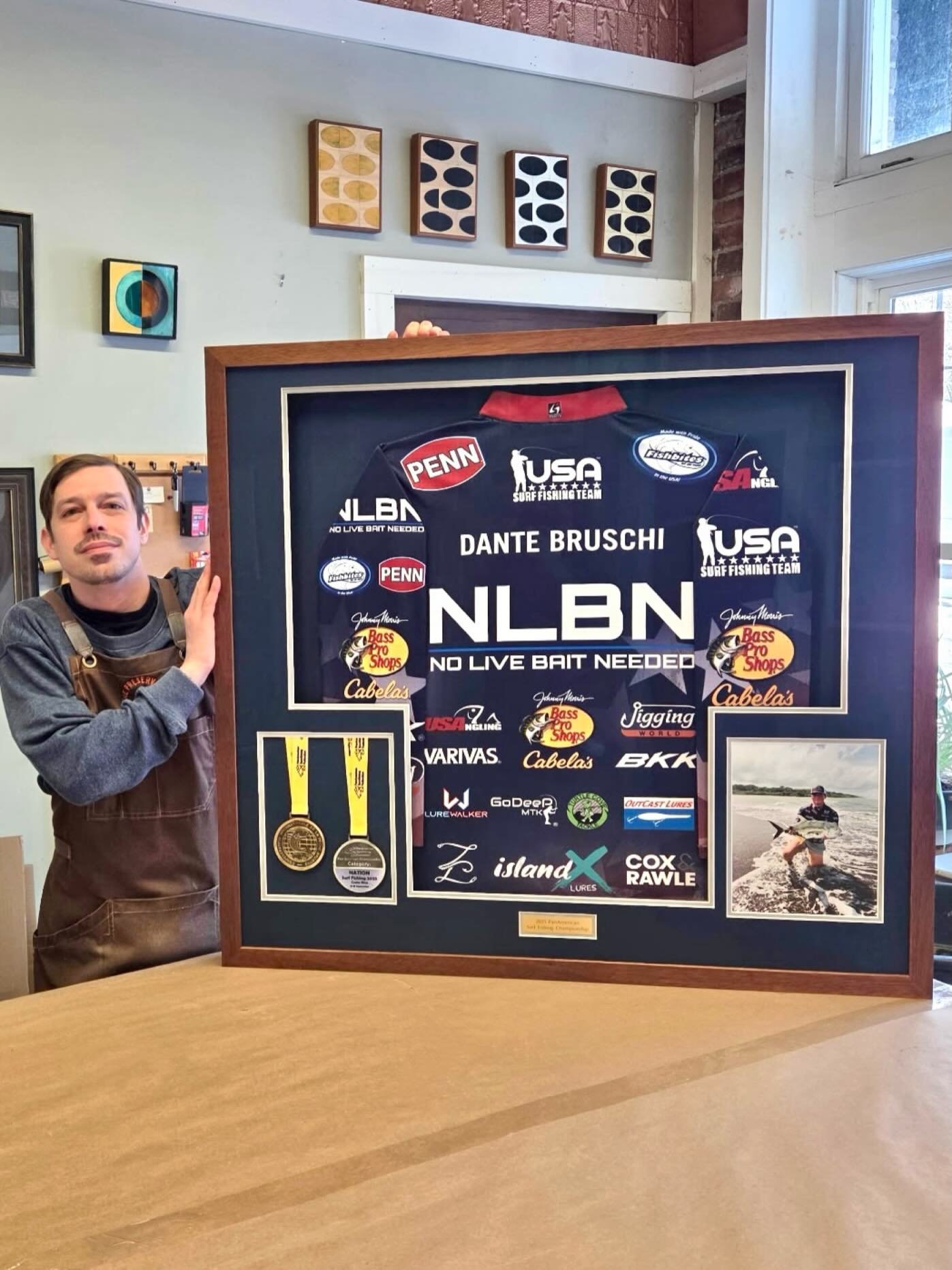 Fishing Championship Jersey, medals, photo and plaque all uniformly arranged and preserved perfectly. Art glass @artglass_by_groglass and linen matting by @crescentbrands give this design UV filtering, low reflection and texture. 👍🏻💪🏻🎣#fishingch