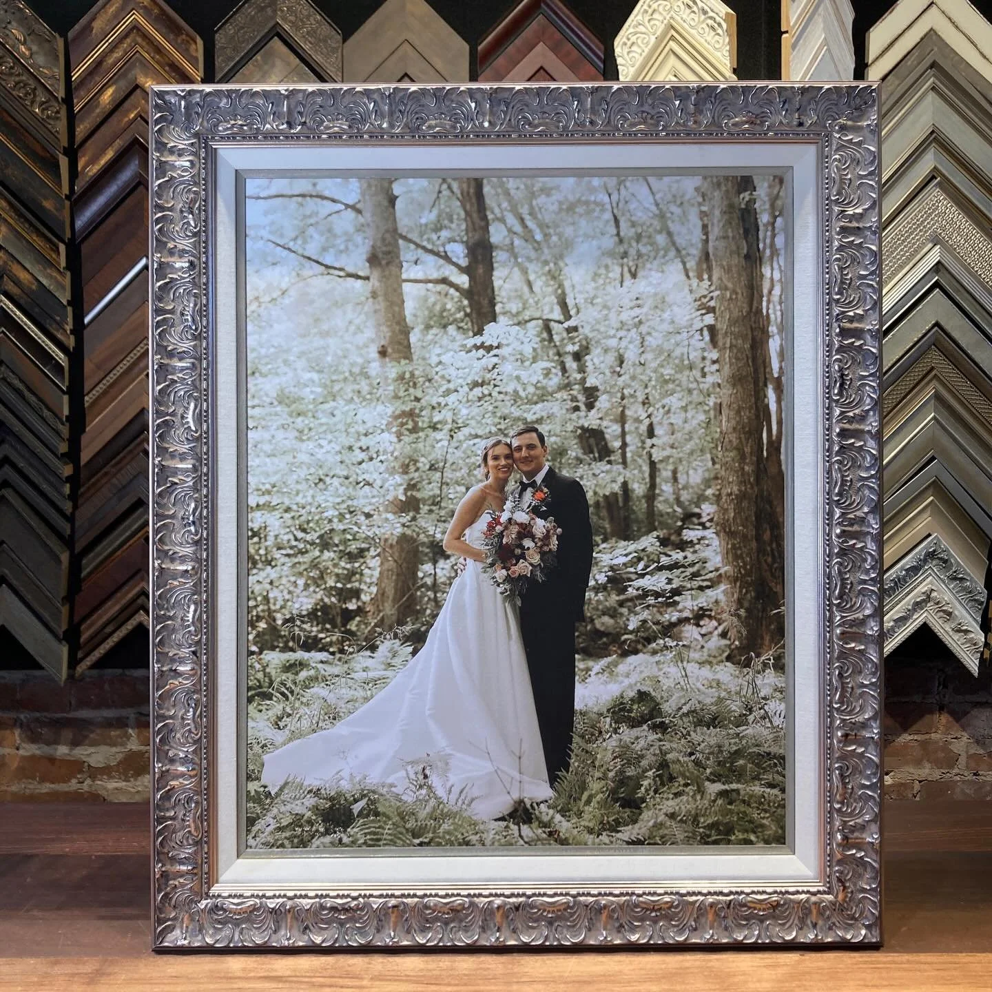 Newlyweds in the forest wrapped in nature. Triple stacked design including decorative silver frame, linen liner and light silver gold wash fillet finished with Artglass 99. 

Clear as Day. Come design with is soon! 

#custompictureframing #newlyweds❤