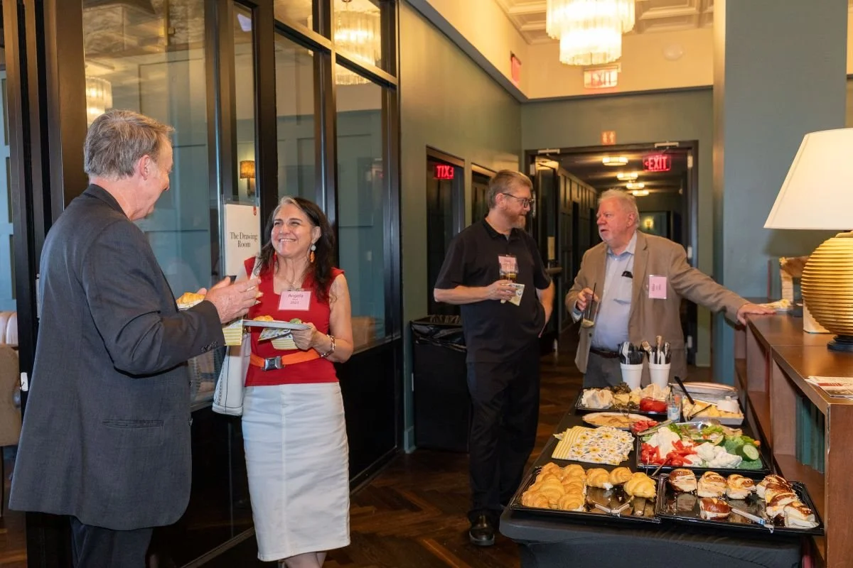Eric Inglert (2002), Angela Mazzi (2022), Doug Richards (2010) and Mike Mauch (2009) enjoy some refreshments.