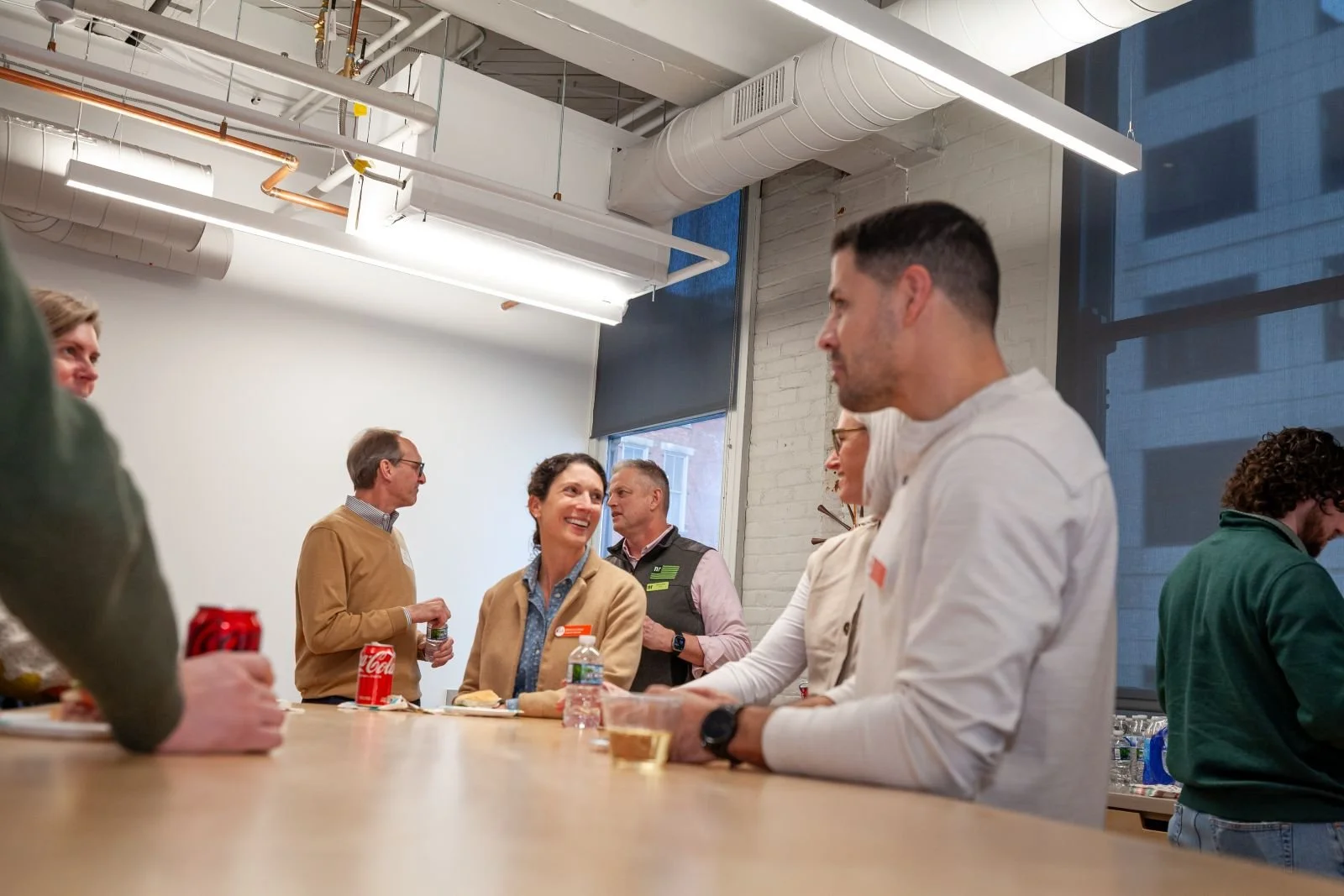AIA Cincinnati members and friends gather before the program. Jeff Raser and Graham Kalbli in the background. Allison McKenzie, Moncia Lowry, Sheri Scott, and Chris Hernandez at the table.