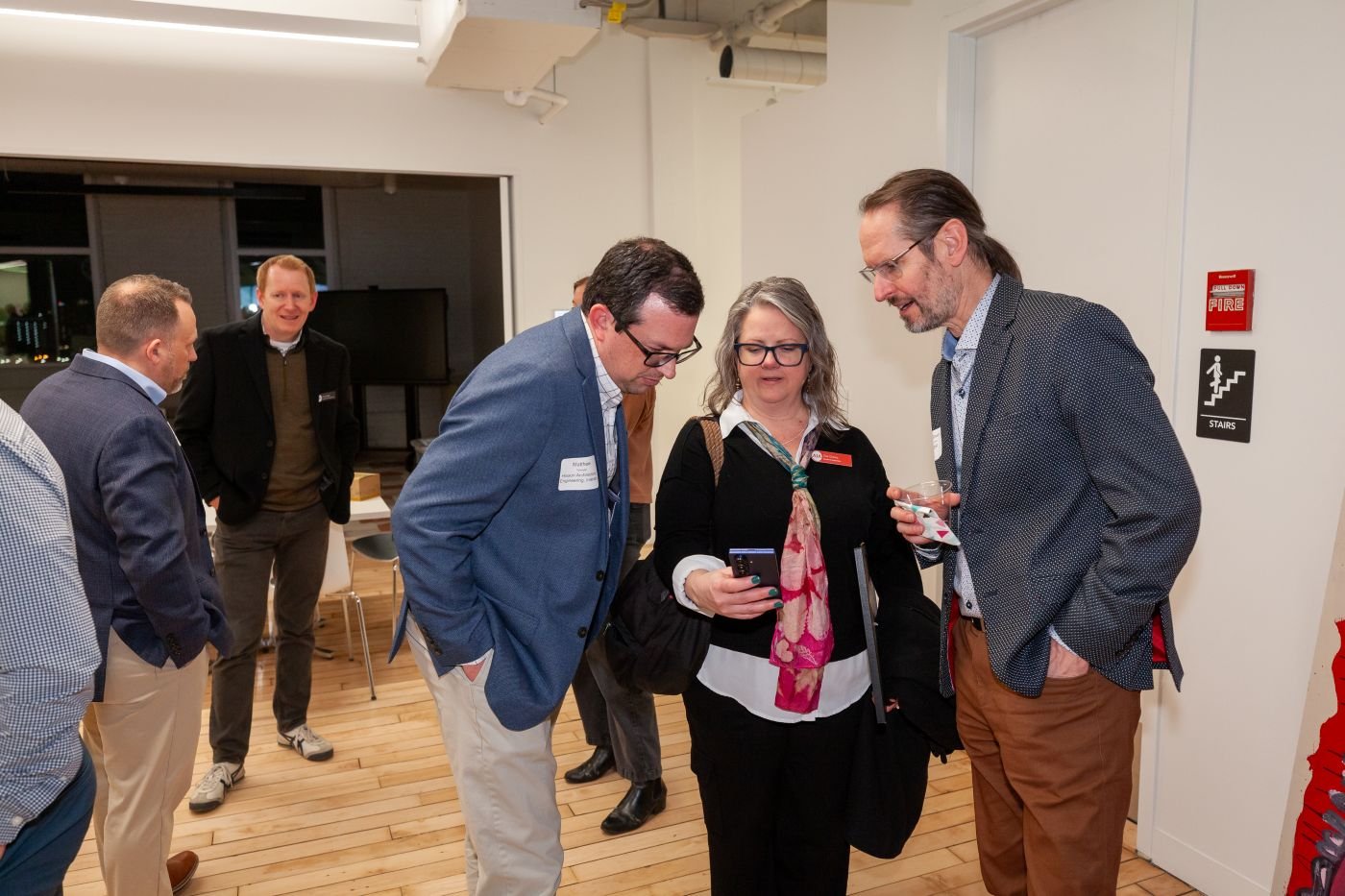 AIA Cincinnati members and friends connect after the program.  Matthew Spangler, Zoe Gizara, and Steve Kenat. Chris Patek in background.