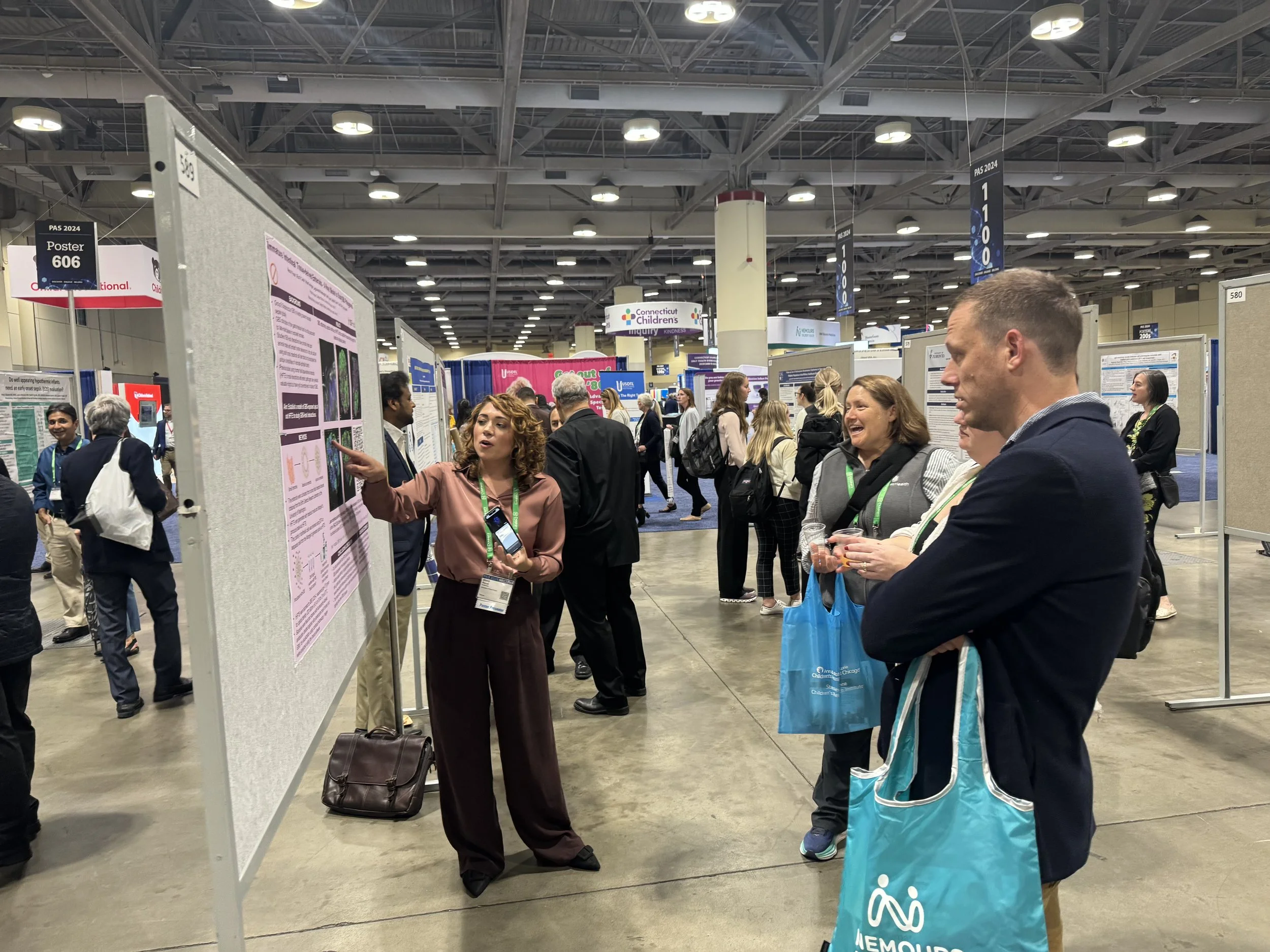 Alexia Pearah presenting a poster at the Pediatric Academic Societies (PAS) Annual Meeting 2024 in Toronto, Canada