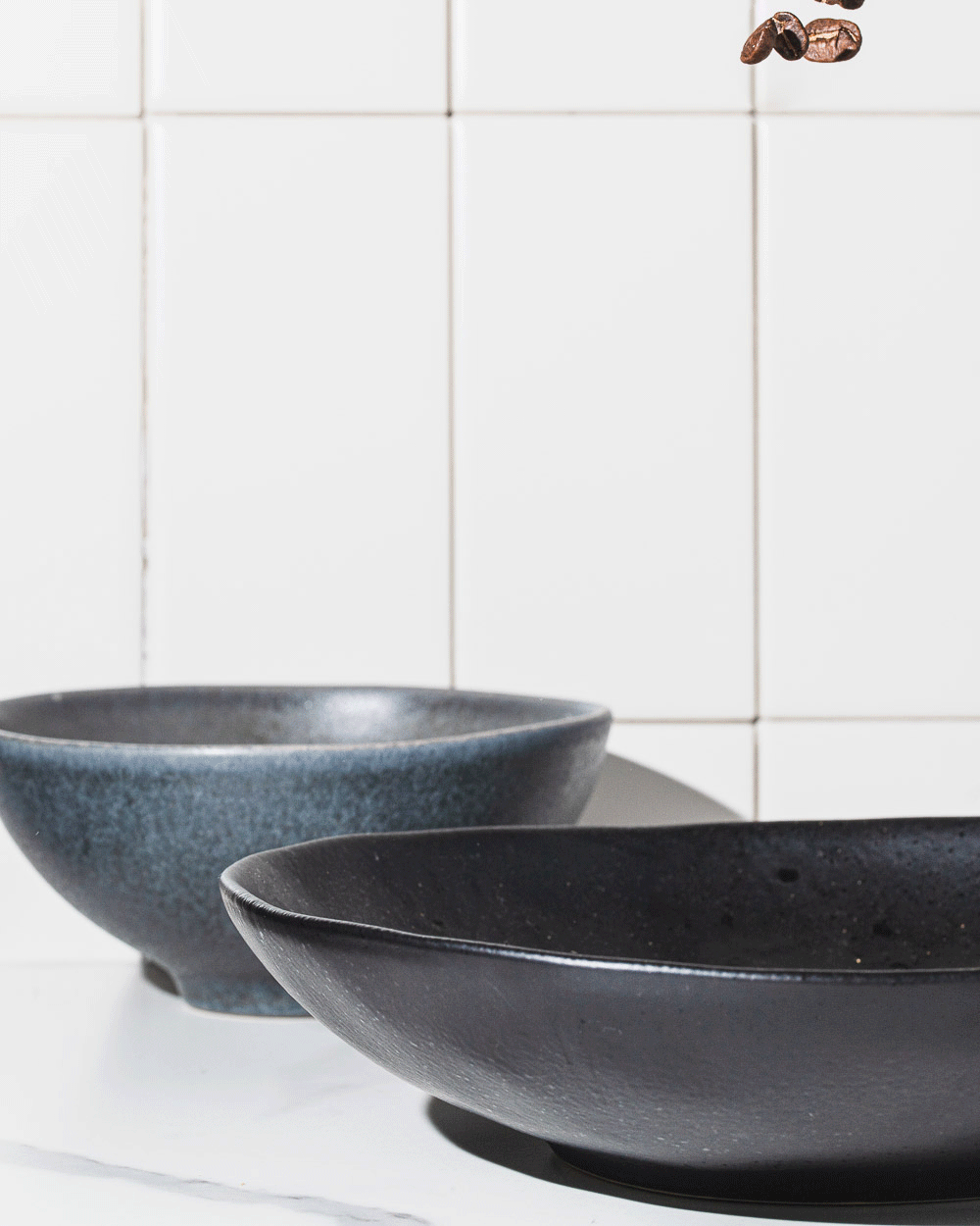 Coffee beans falling into a bowl gif