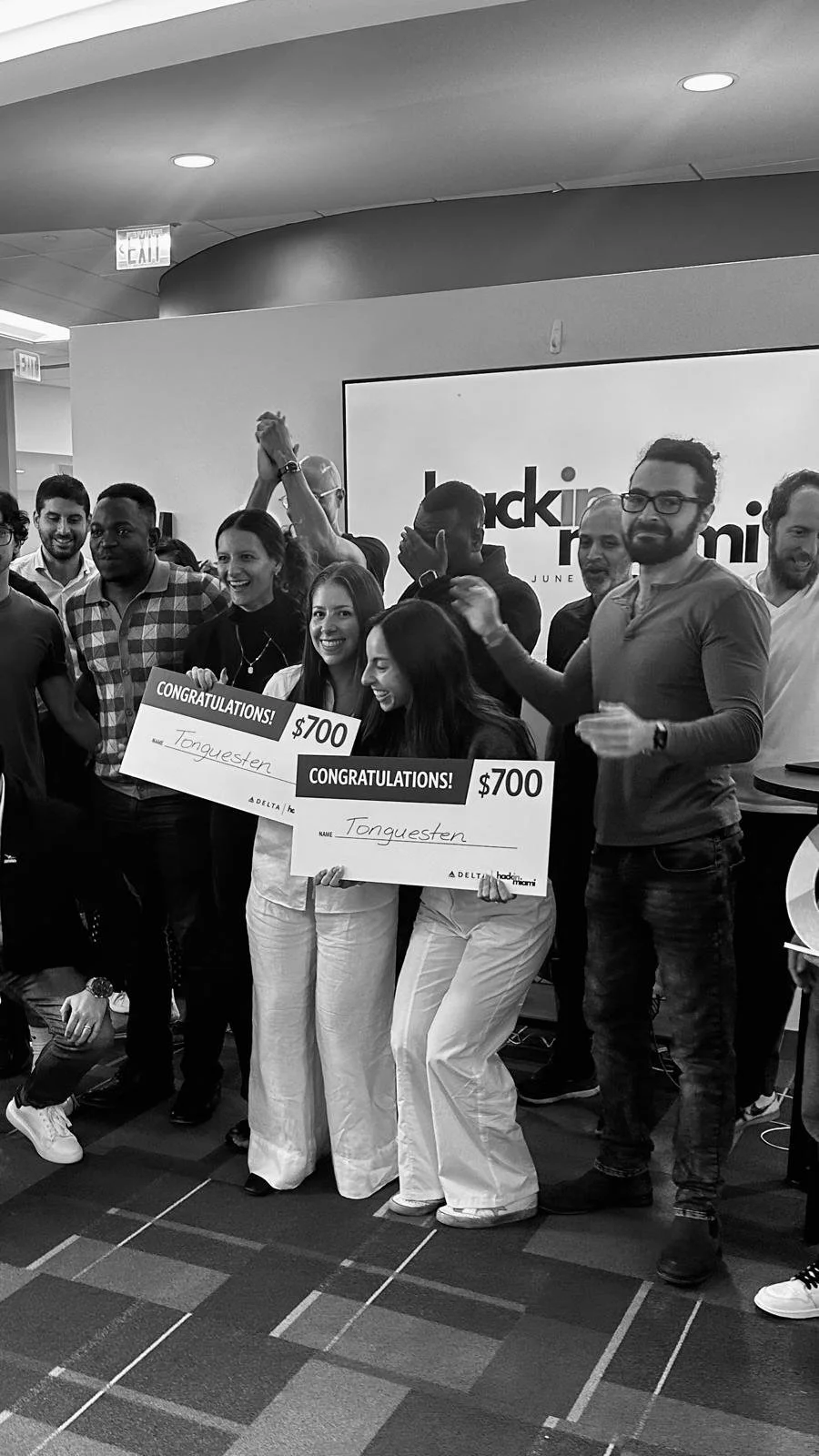Tonguesten team winning second place at Hack in Miami 2024