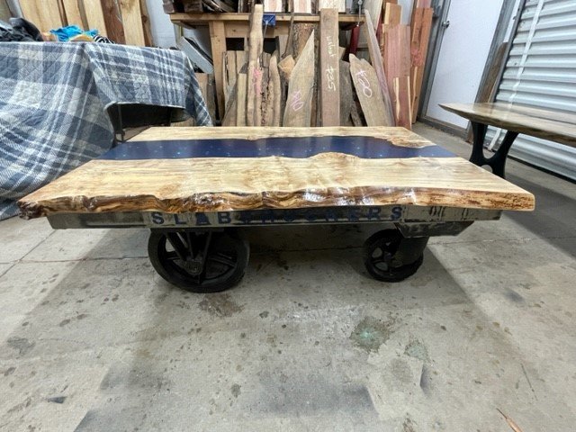 Maple Burl River Coffee Table on industrial cart base