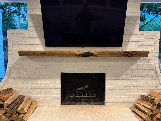 Monster Hickory Live Edge Mantel in a smokey brown finish with black void fills