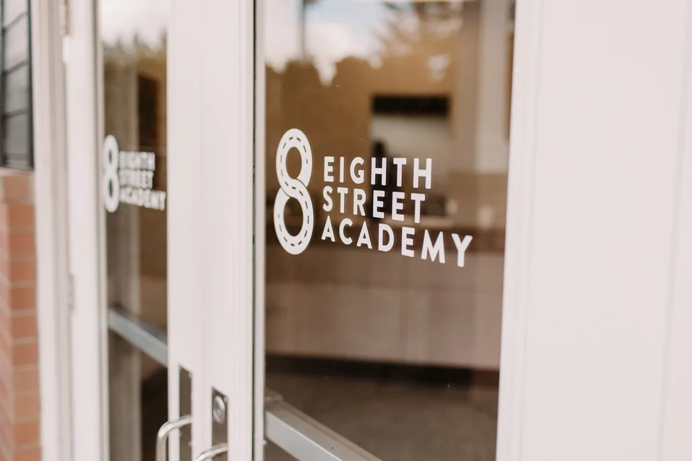 The entrance doors at 8th Street Academy