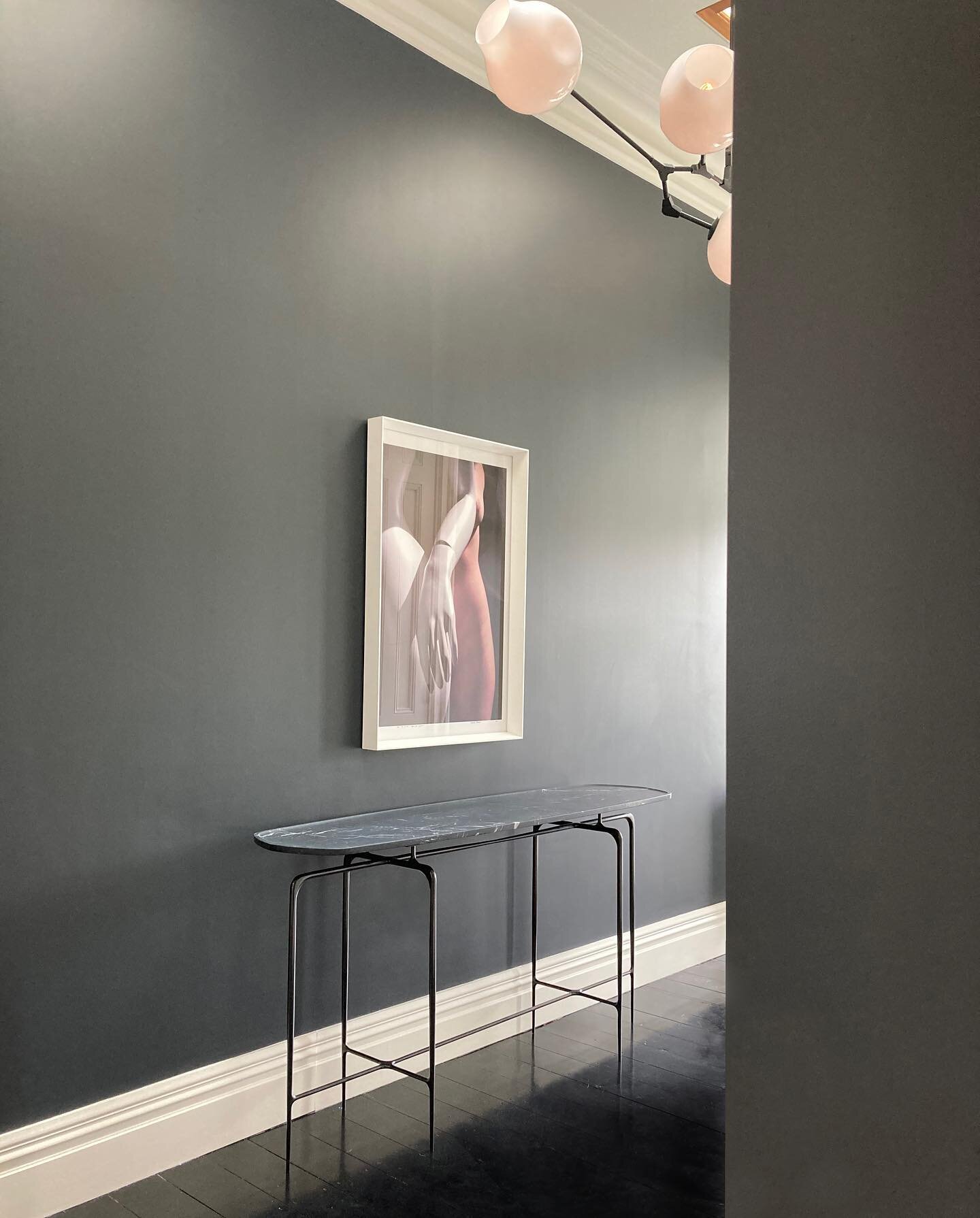The refined elegance of this custom made console by @castedesign coupled with a simple art piece is all our client&rsquo;s entryway needed. This pairing creates a moment of calm; to pause, to reflect, before heading out into the city for a hustle and