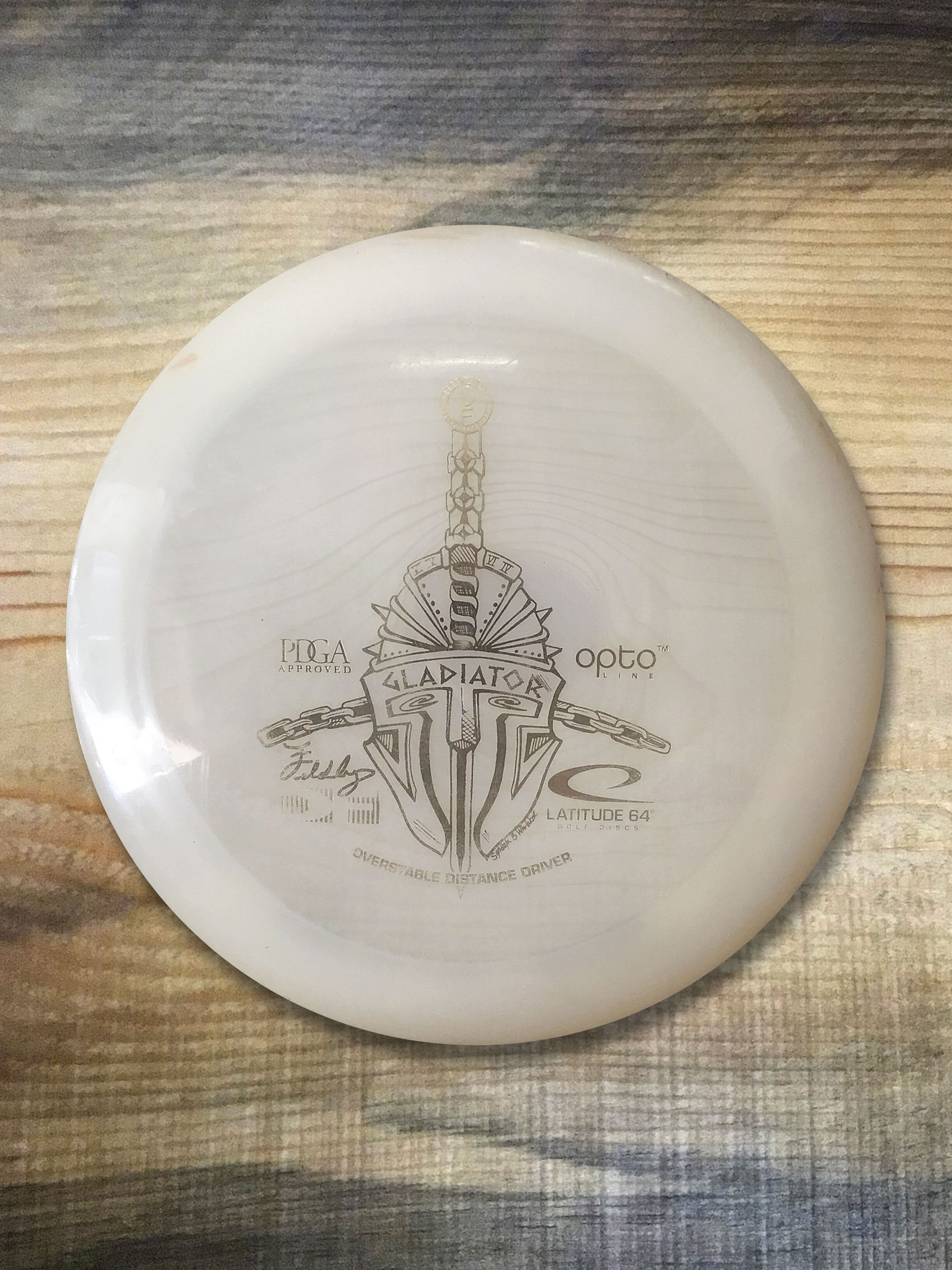 NORTH_IDAHO_DISCS_LATITUDE64_GLADIATOR_CLR_GLD_173G_USED.jpg